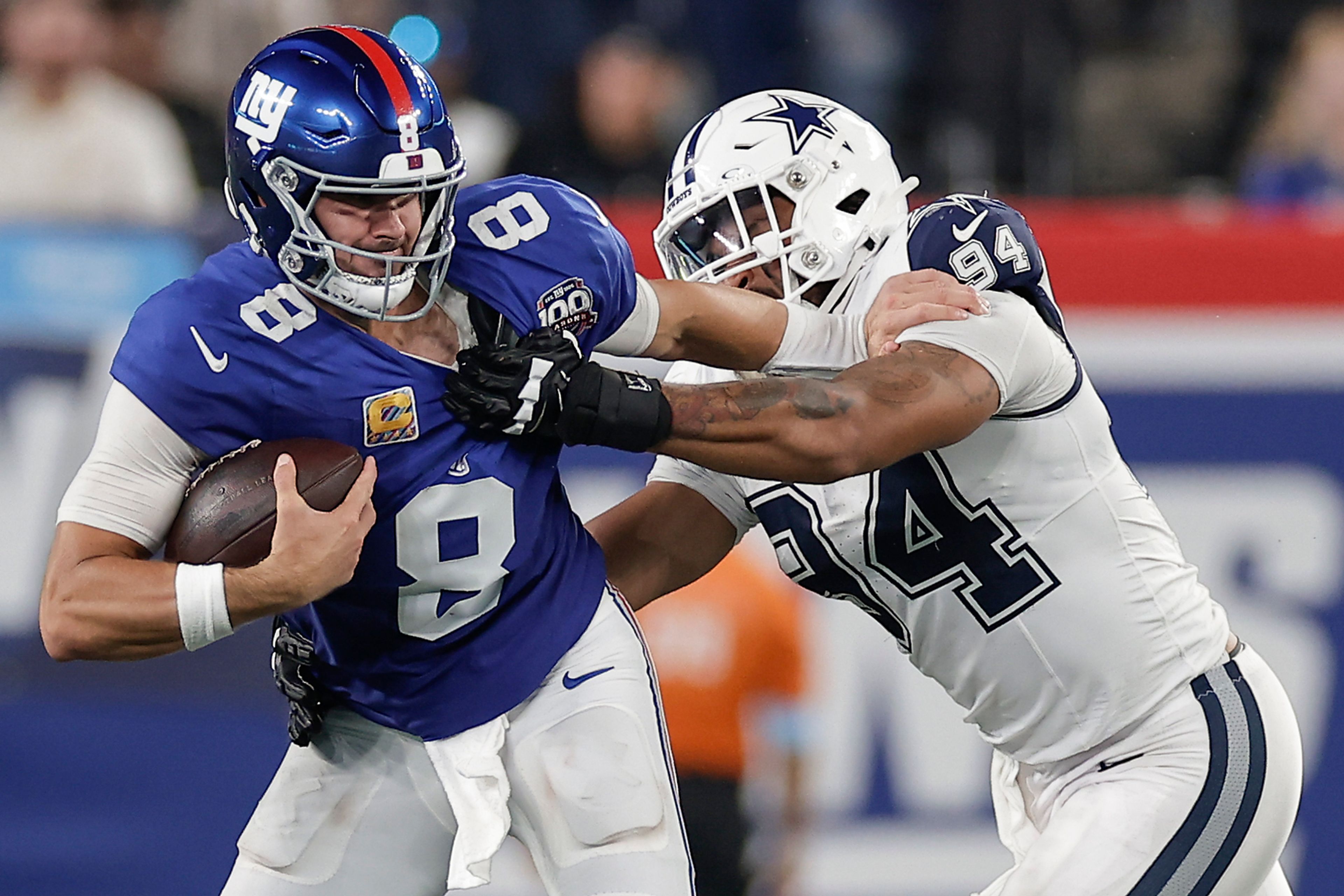 New York Giants quarterback Daniel Jones (8) is sacked by Dallas Cowboys defensive end Marshawn Kneeland (94) during the third quarter of an NFL football game, Thursday, Sept. 26, 2024, in East Rutherford, N.J. (AP Photo/Adam Hunger)