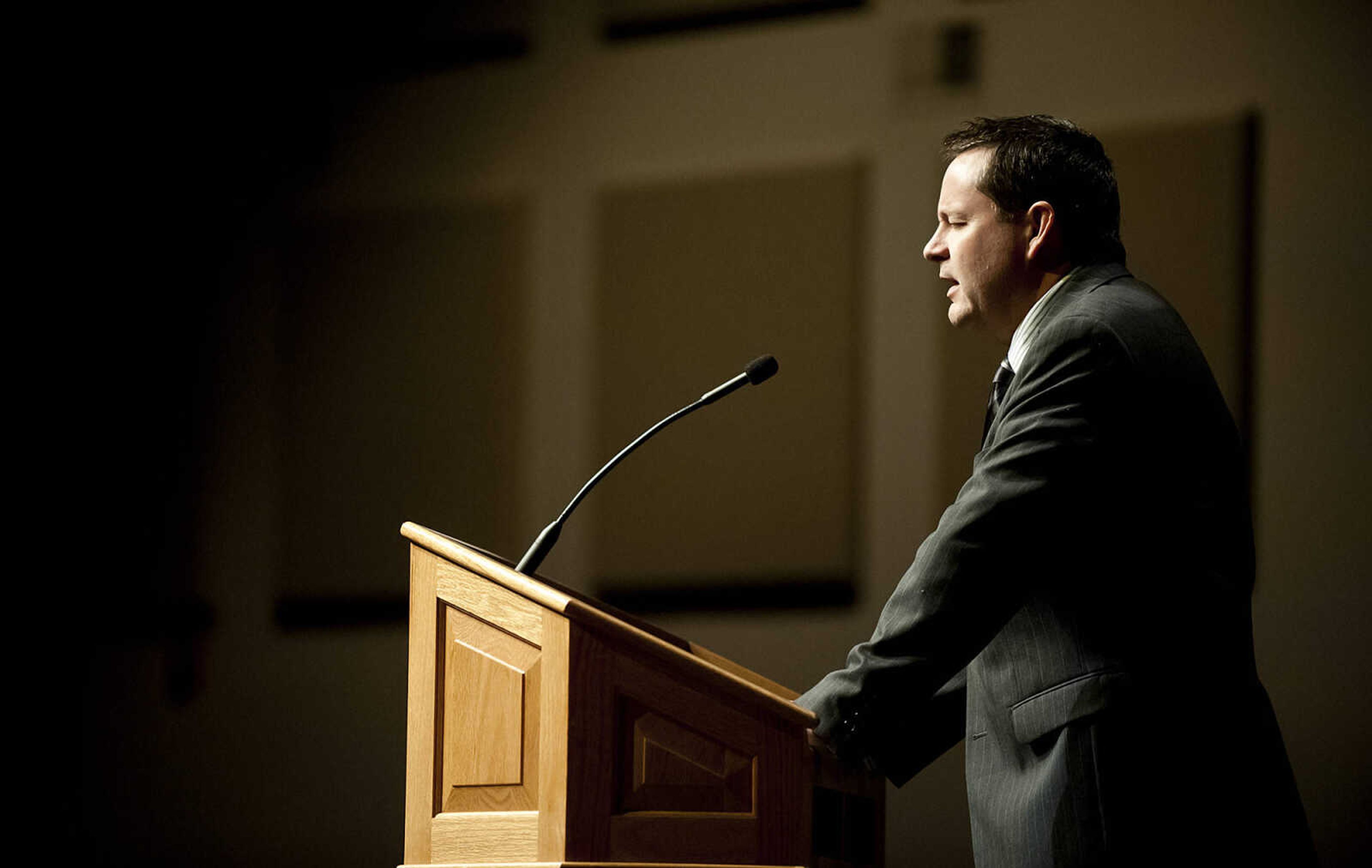 Shawn Wasson, pastor at Bethany Baptist Church, leads the closing prayer during the Senior and Lawmen Together Law Enforcement Memorial Friday, May 9, at the Cape Bible Chapel. The annual memorial honored the 48 Southeast Missouri law enforcement officers that have died in the line of duty since 1875.