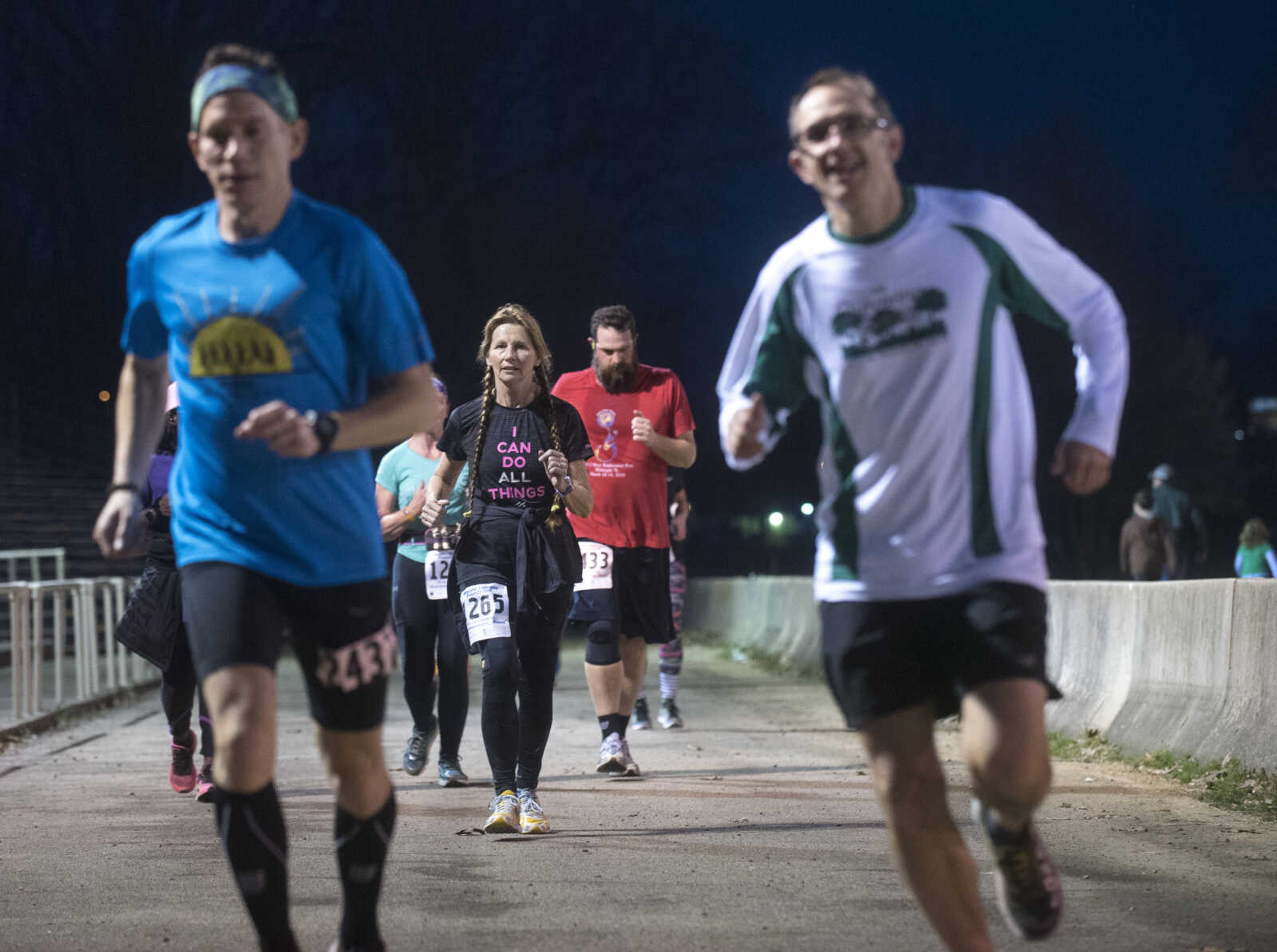 Participants make their way around the 1-mile loop set up at Arena Park for the 8th annual Howard Aslinger Endurance Run on Friday, March 17, 2017 in Cape Girardeau. The event raises money for the Howard L. Aslinger Memorial Scholarship where runners will keep running until they can't anymore with the event starting at 7 p.m. Friday night going for 24 hours until Saturday night.