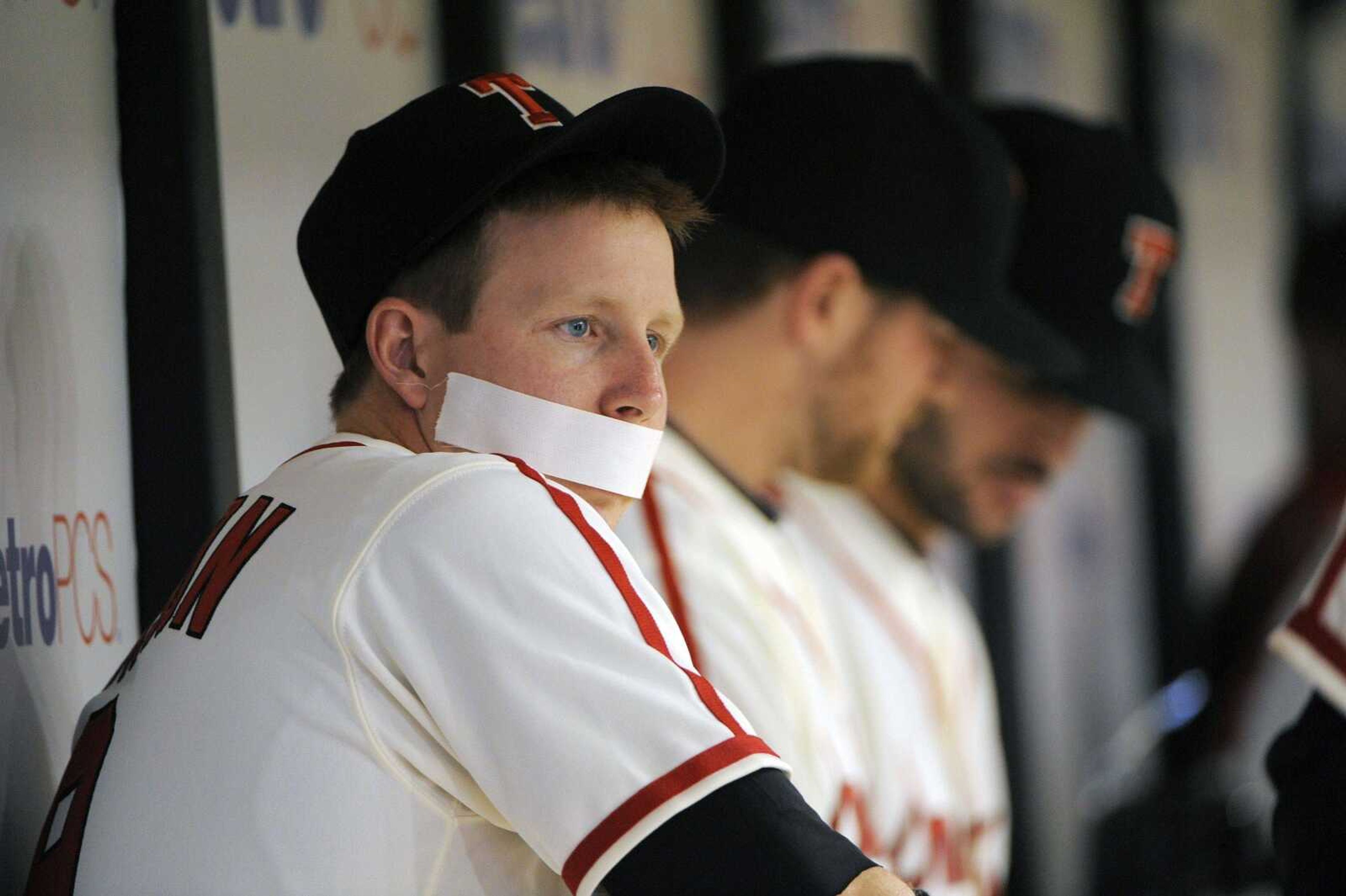 The Rays' Elliot Johnson jokingly places tape over his mouth in the dugout during Saturday's game against the Cardinals. Johnson was one of four Rays ejected from Friday night's game, which St. Louis won 5-3. A game story and box score from Friday' game is on Page 5B.