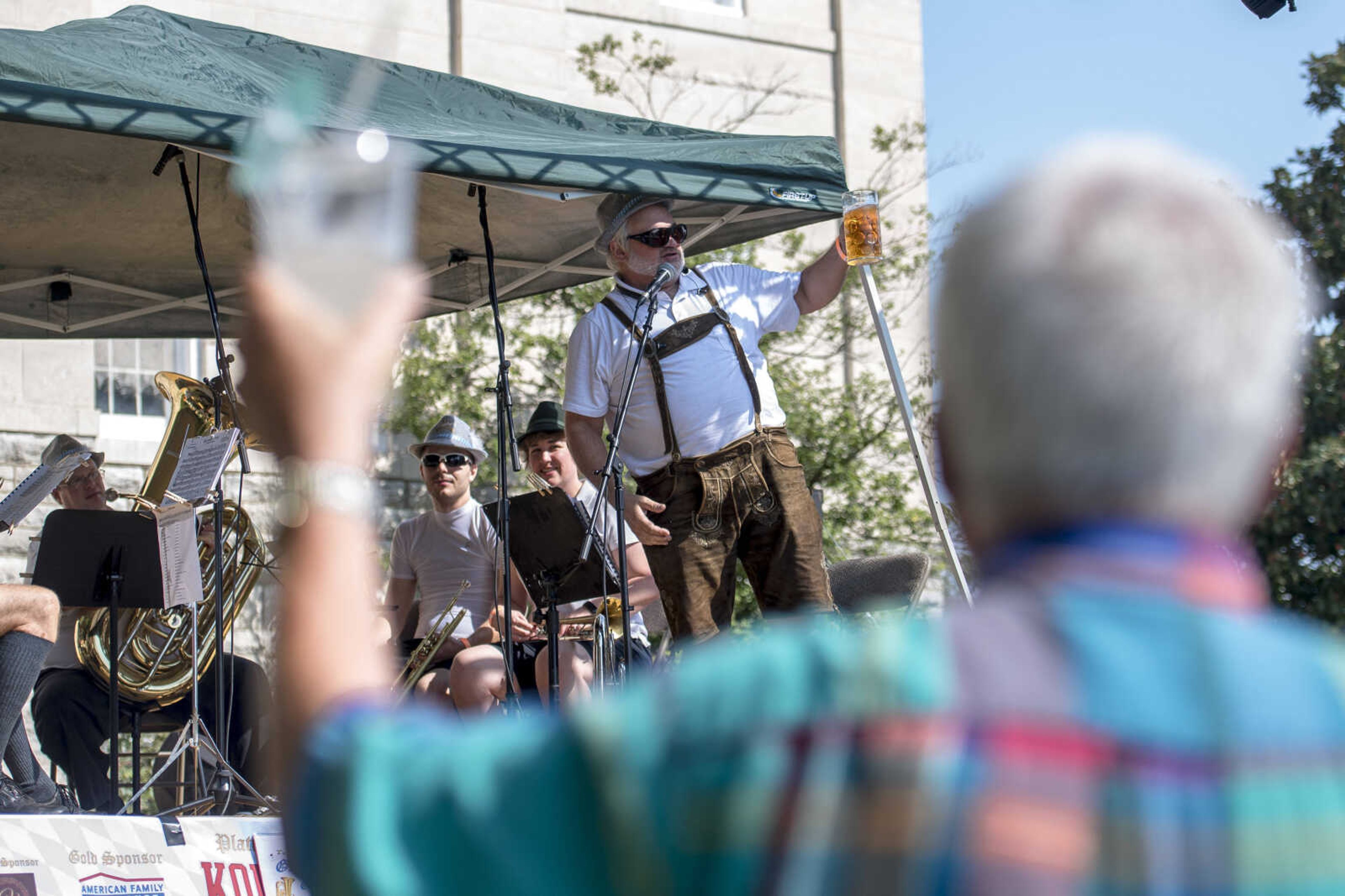 The GemŸtlichkeit German Band leads a toast Oct. 6, 2018, during Uptown Jackson Oktoberfest.