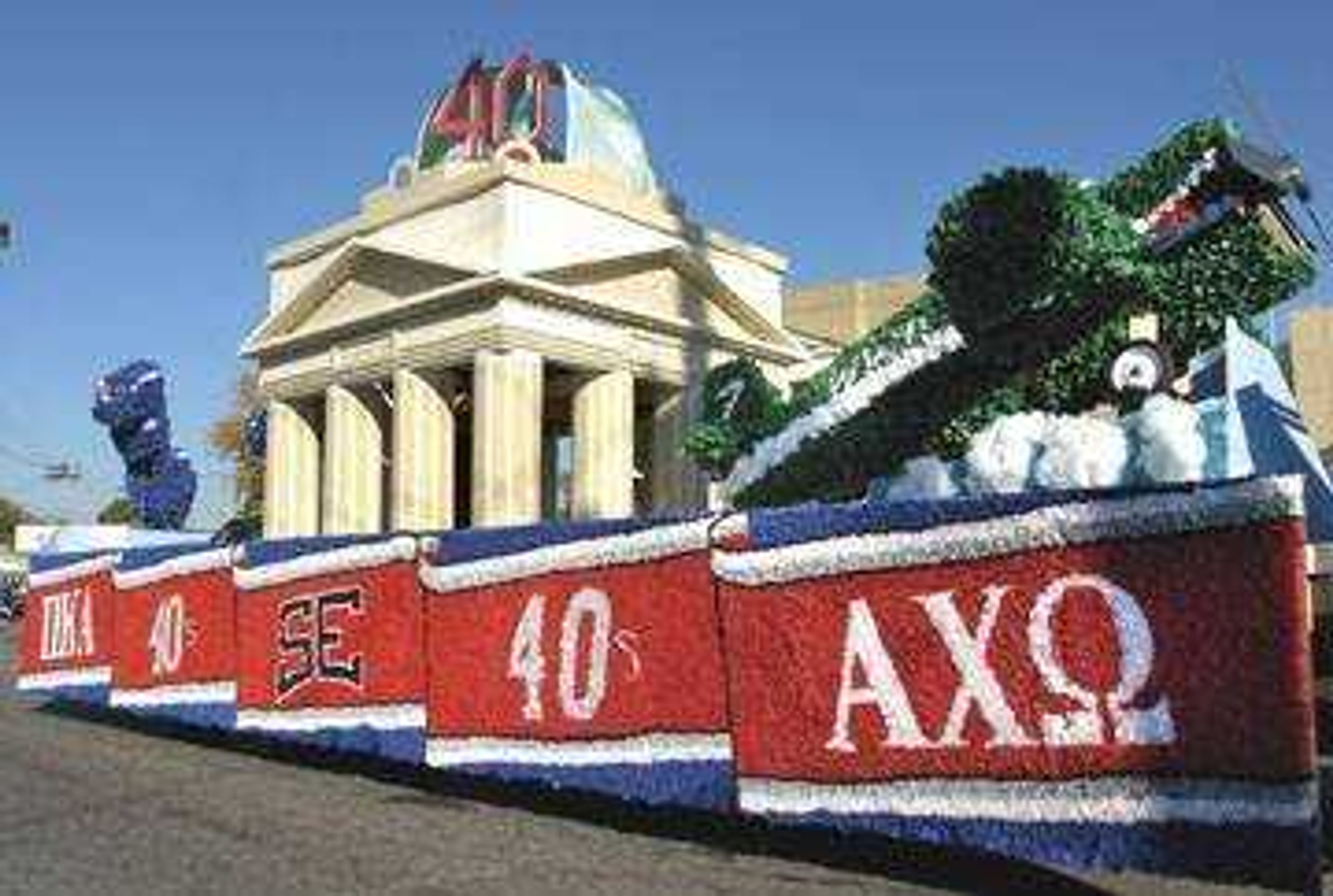 Pi Kappa Alpha and Alpha Chi Omega won first place in the large float competition with a 1940s theme.