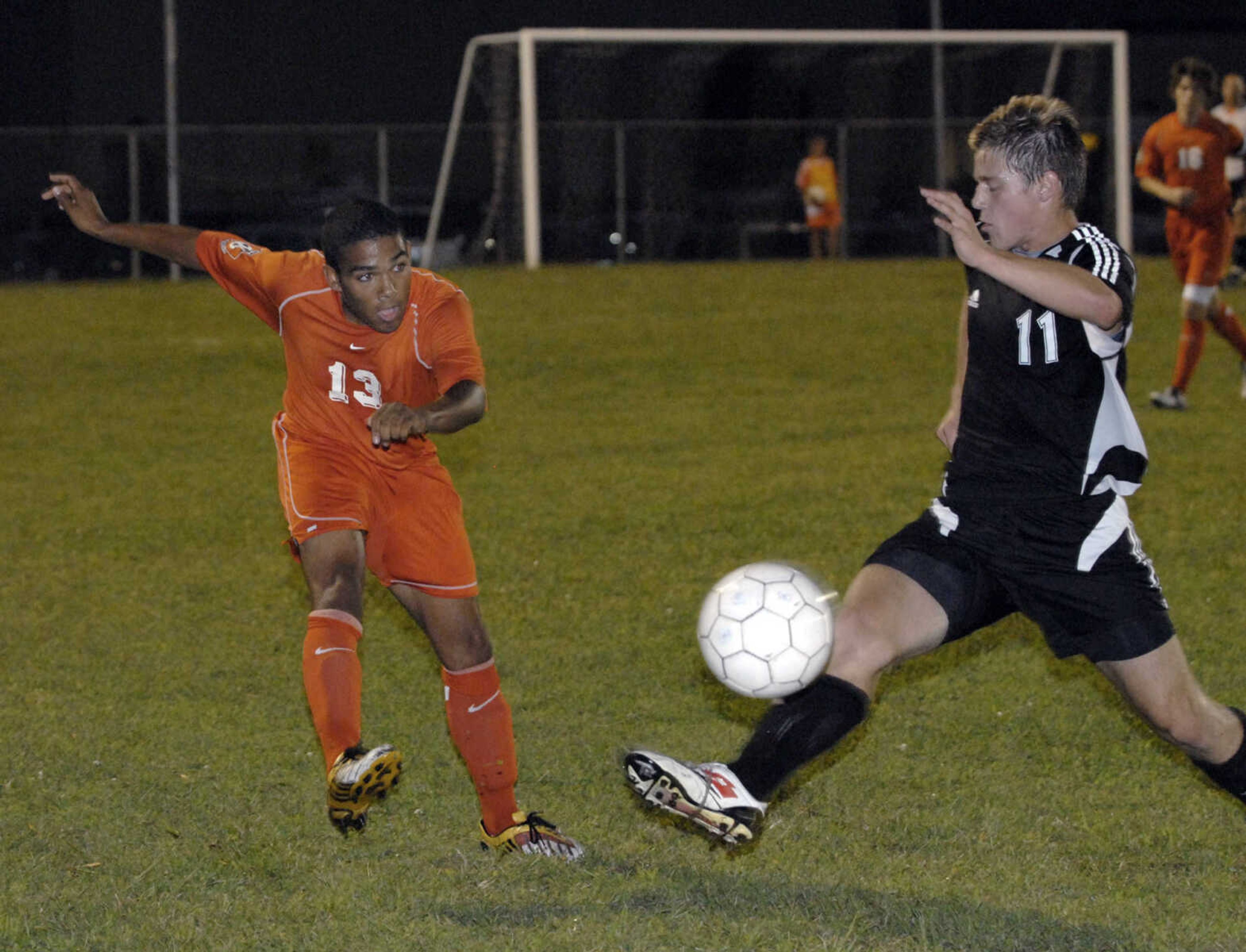 FRED LYNCH ~ flynch@semissourian.com
Central's Dominique Jones kicks the ball past Jackson's Law Duncan during the first half Tuesday at Central.