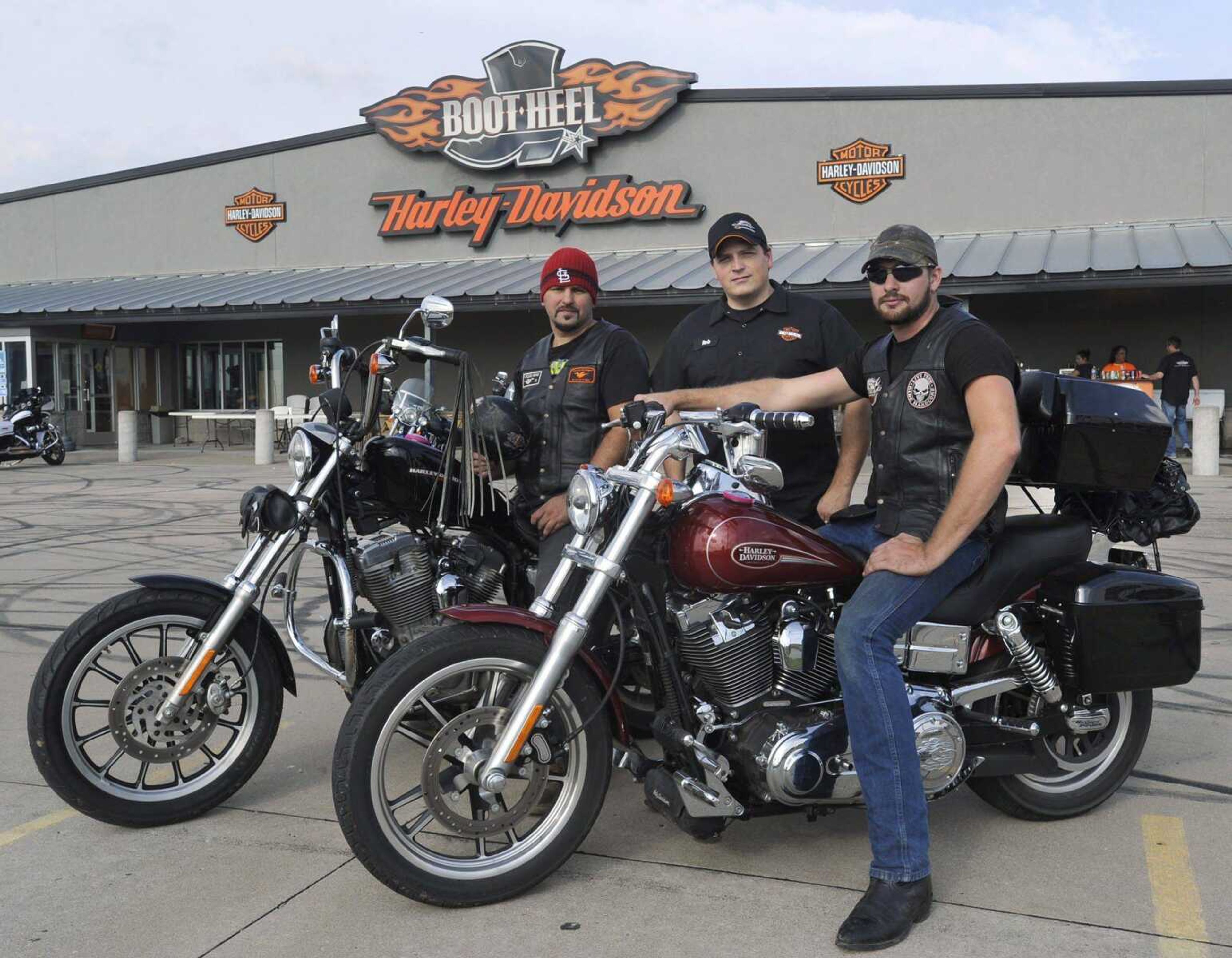 Brian Winans, left, and Mike Taylor, right, pose with Rob Hocking, owner of Bootheel Harley-Davidson. Bootheel Harley-Davidson sponosred Winans and Taylor in their Cancer Aware Harley Dare &#8212; a 1,000 mile ride to Florida in less than 24 hours to raise cancer awareness. (Fred Lynch)