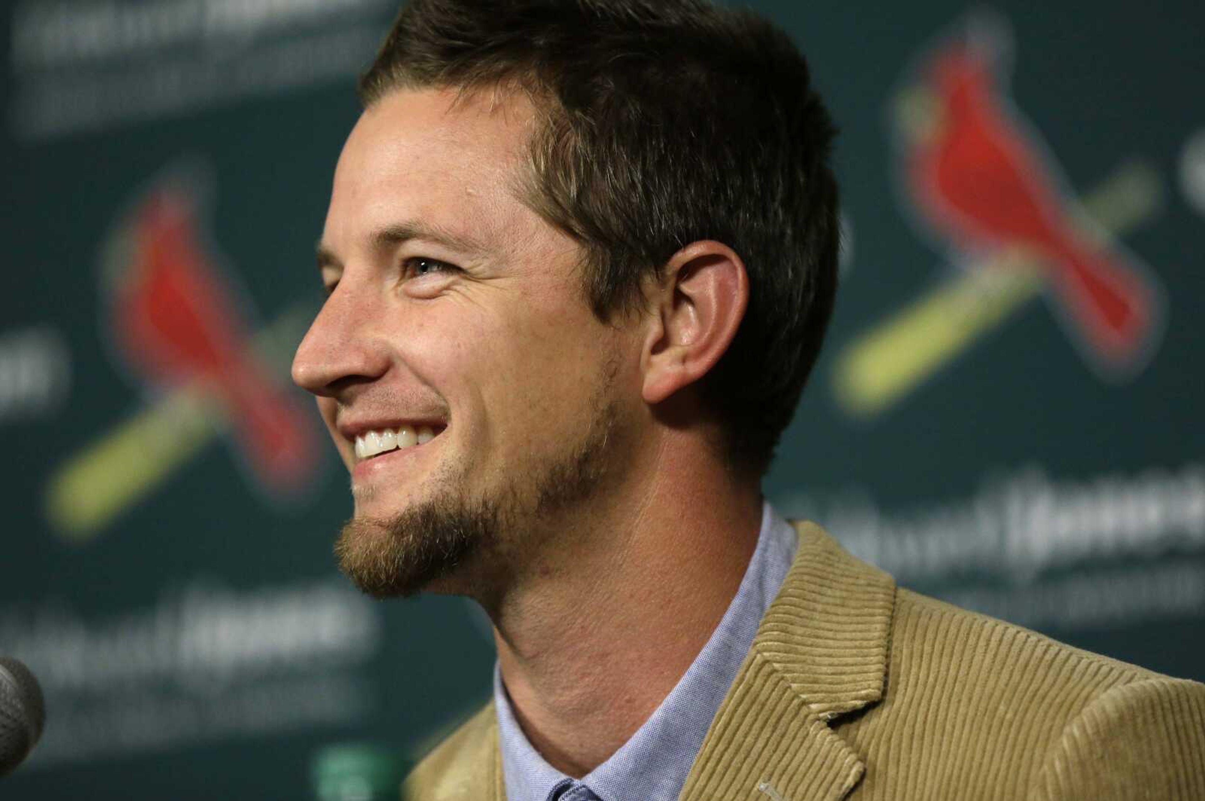 Mike Leake smiles during a news conference introducing the free agent as the newest member of the Cardinals pitching staff Tuesday in St. Louis. (Jeff Roberson ~ Associated Press)