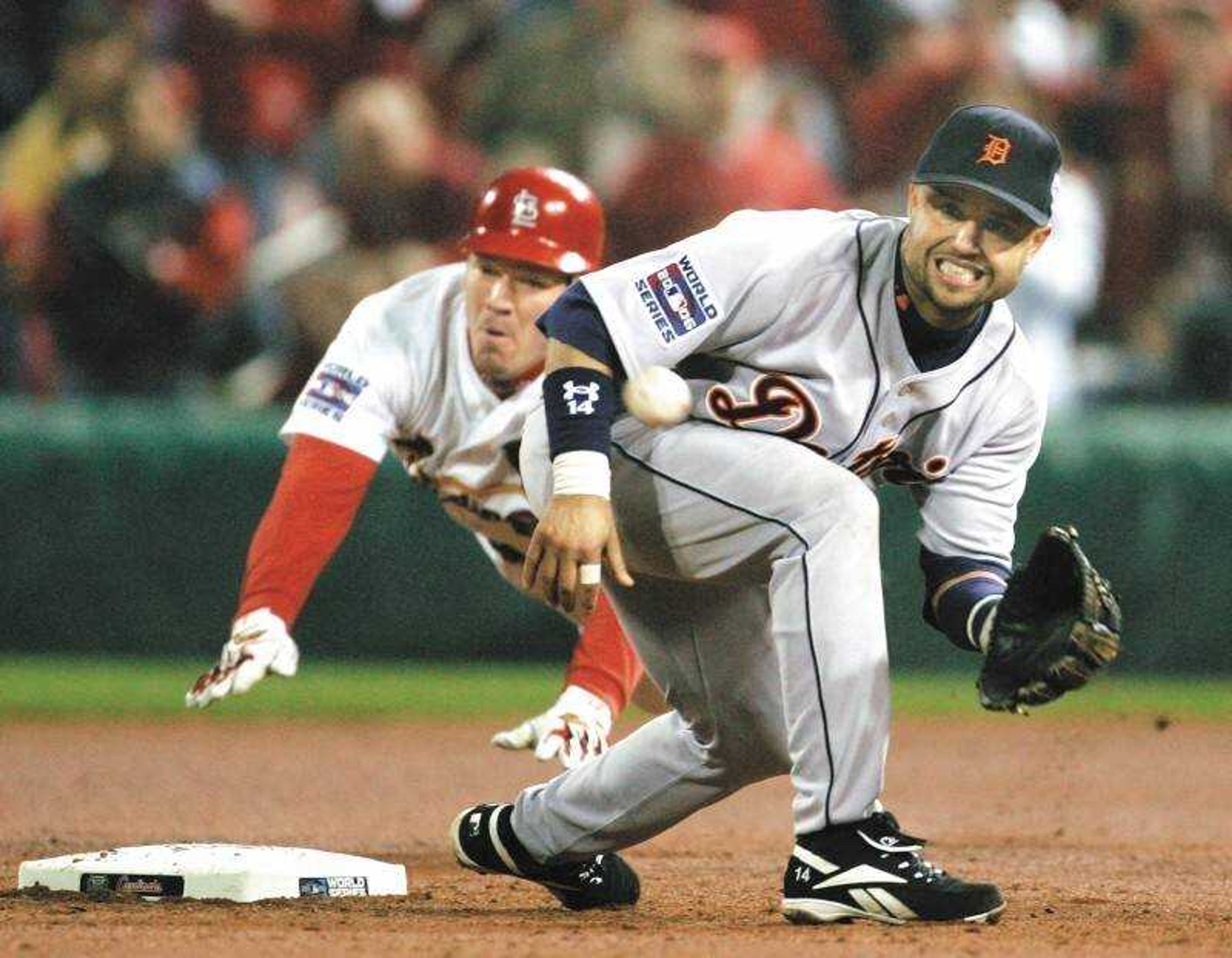 Detroit Tigers second baseman Placido Polanco waited for the throw as St. Louis Cardinals third baseman Scott Rolen slid into second with a double in the fourth inning of Game 4 of the World Series on Thursday. (Associated Press)