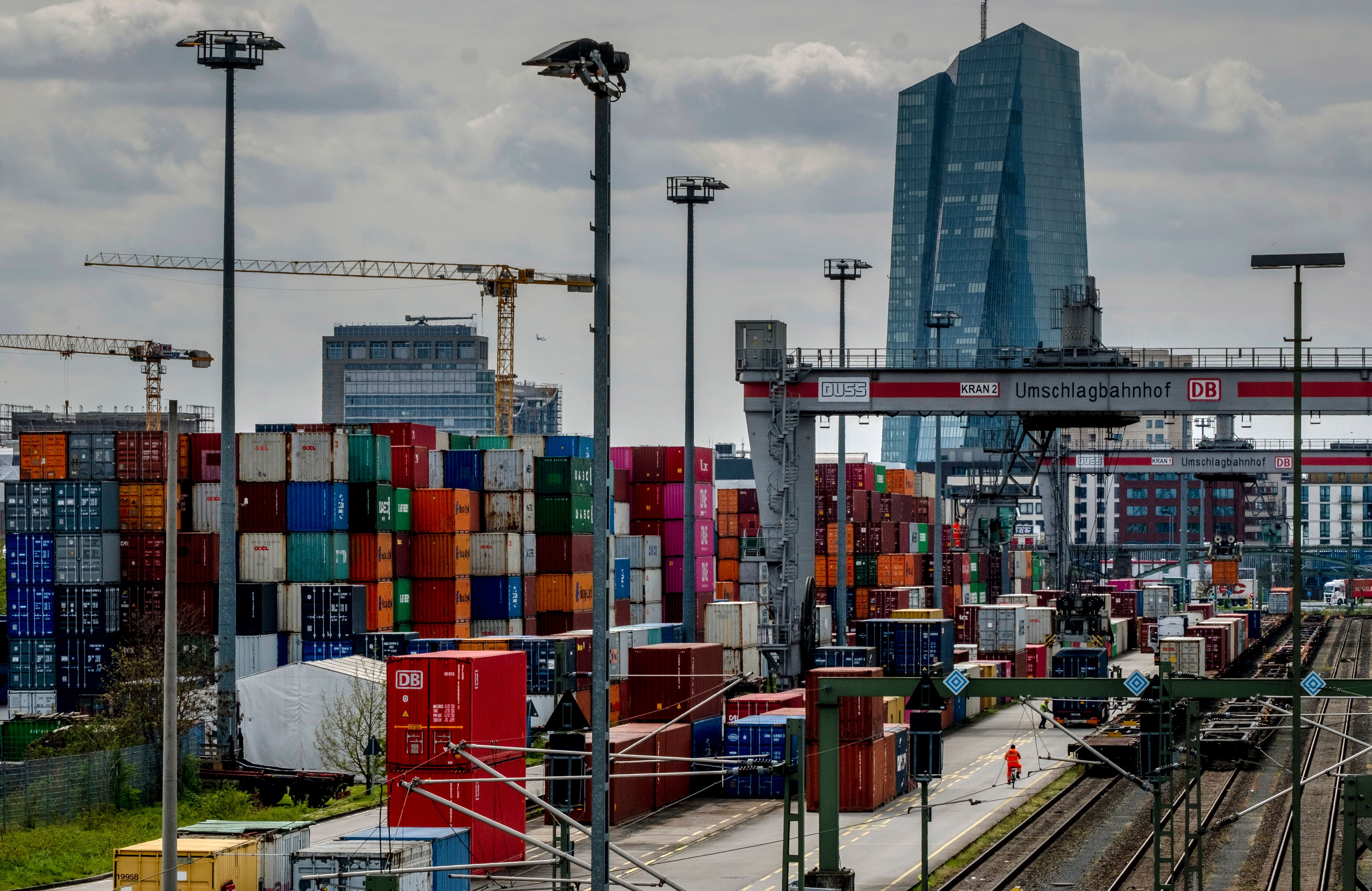 FILE - Containers are piled up at a cargo terminal of Deutsche Bahn in Frankfurt, Germany, Wednesday, April 26, 2023. In the background is the European Central Bank building. (AP Photo/Michael Probst, File)