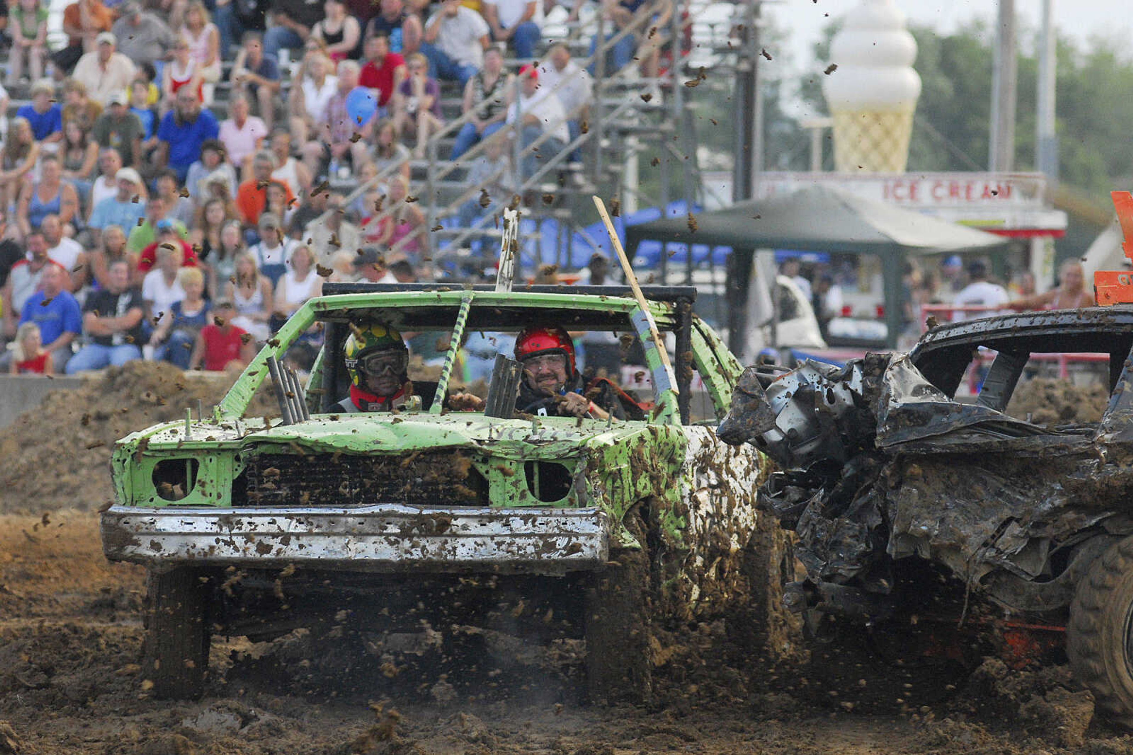 LAURA SIMON~lsimon@semissourian.com
The Dual Demolition Derby is a messy endeavor during the U.S.A. Veterans Fourth of July celebration at Arena Park in Cape Girardeau Sunday, July 4, 2010.