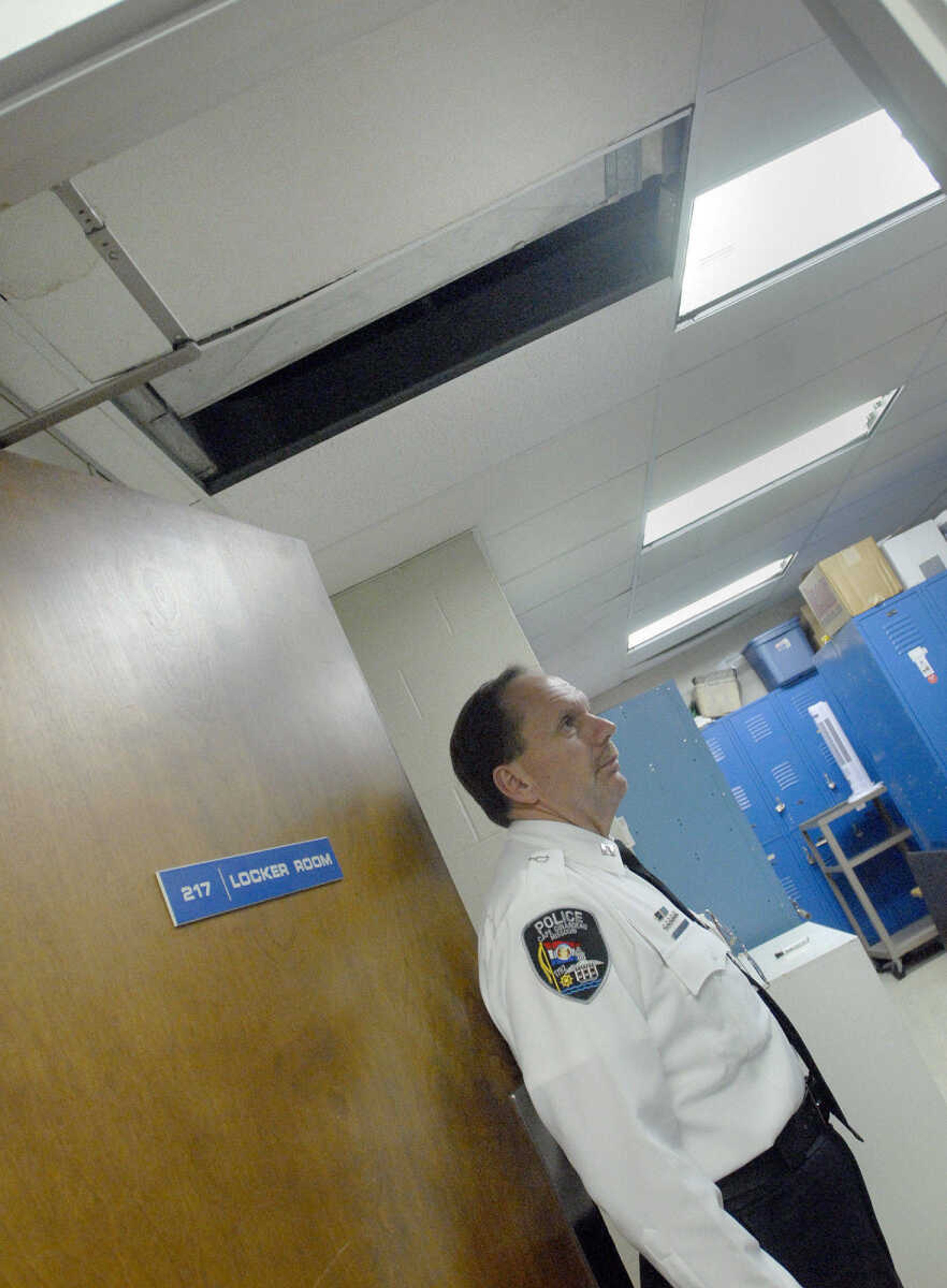 LAURA SIMON ~ lsimon@semissourian.com
Captain Jack Wimp shows a leaky ceiling in the locker room on the second floor Friday, February 10, 2012 inside the Cape Girardeau Police Department.