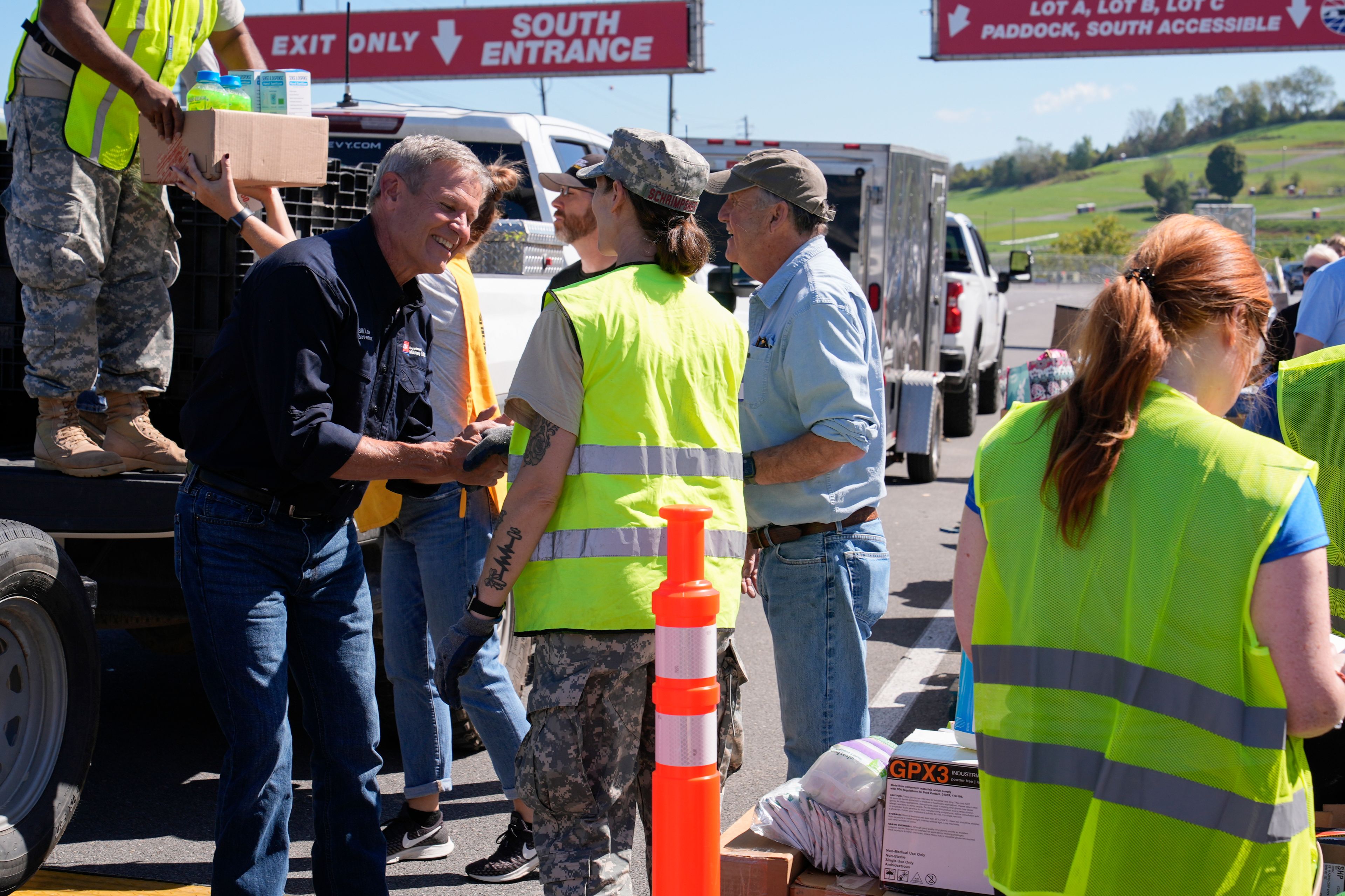 Tennessee Gov. Bill Lee visits with volunteers at the the East Tennessee Disaster Relief Center, for Hurricane Helene disaster response Monday, Oct. 7, 2024, in Bristol, Tenn. (AP Photo/George Walker IV via Pool)