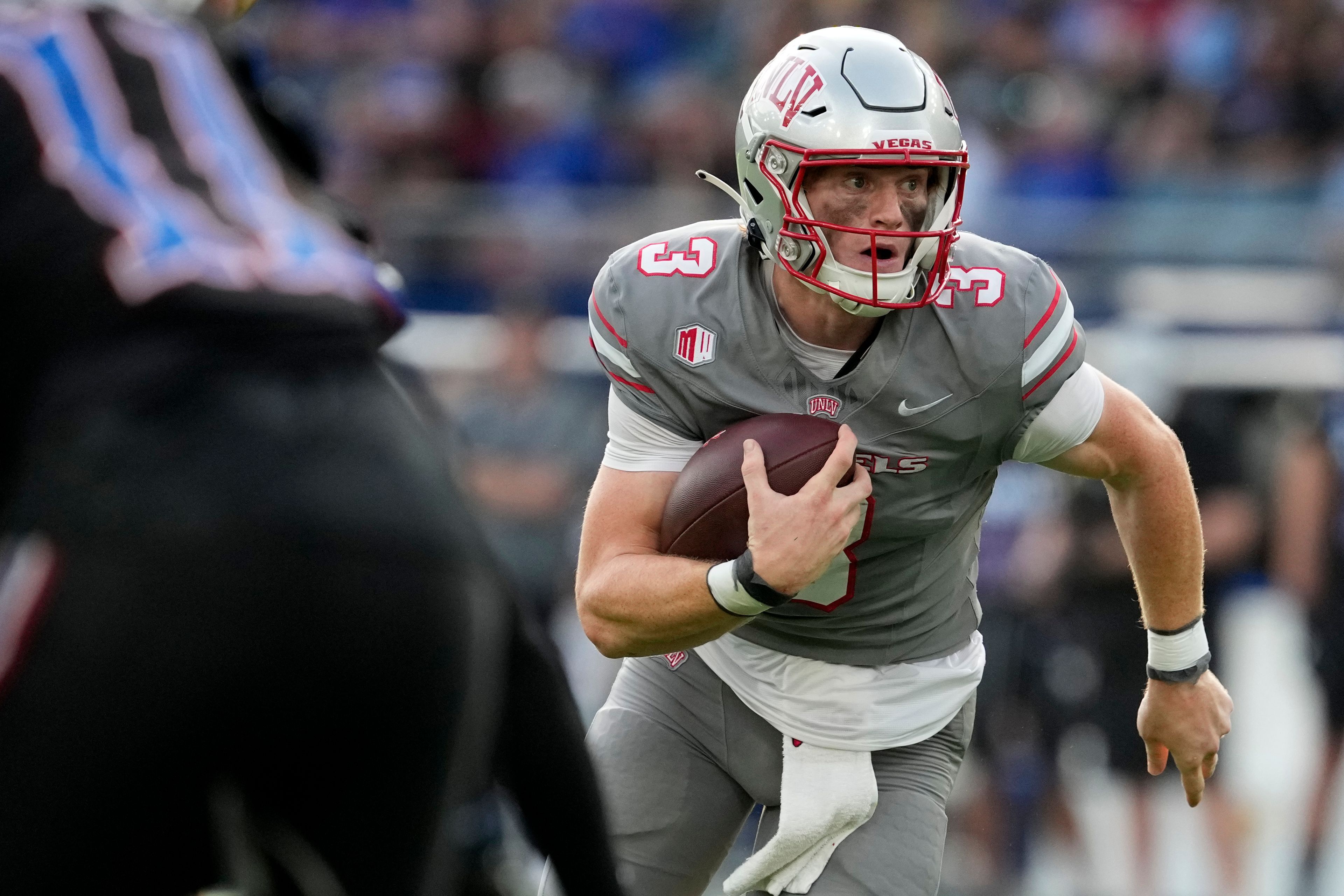 UNLV quarterback Matthew Sluka runs with the ball in the first half against Kansas during an NCAA college football game Friday, Sept. 13, 2024, at Children's Mercy Park in Kansas City, Kan. (AP Photo/Ed Zurga)