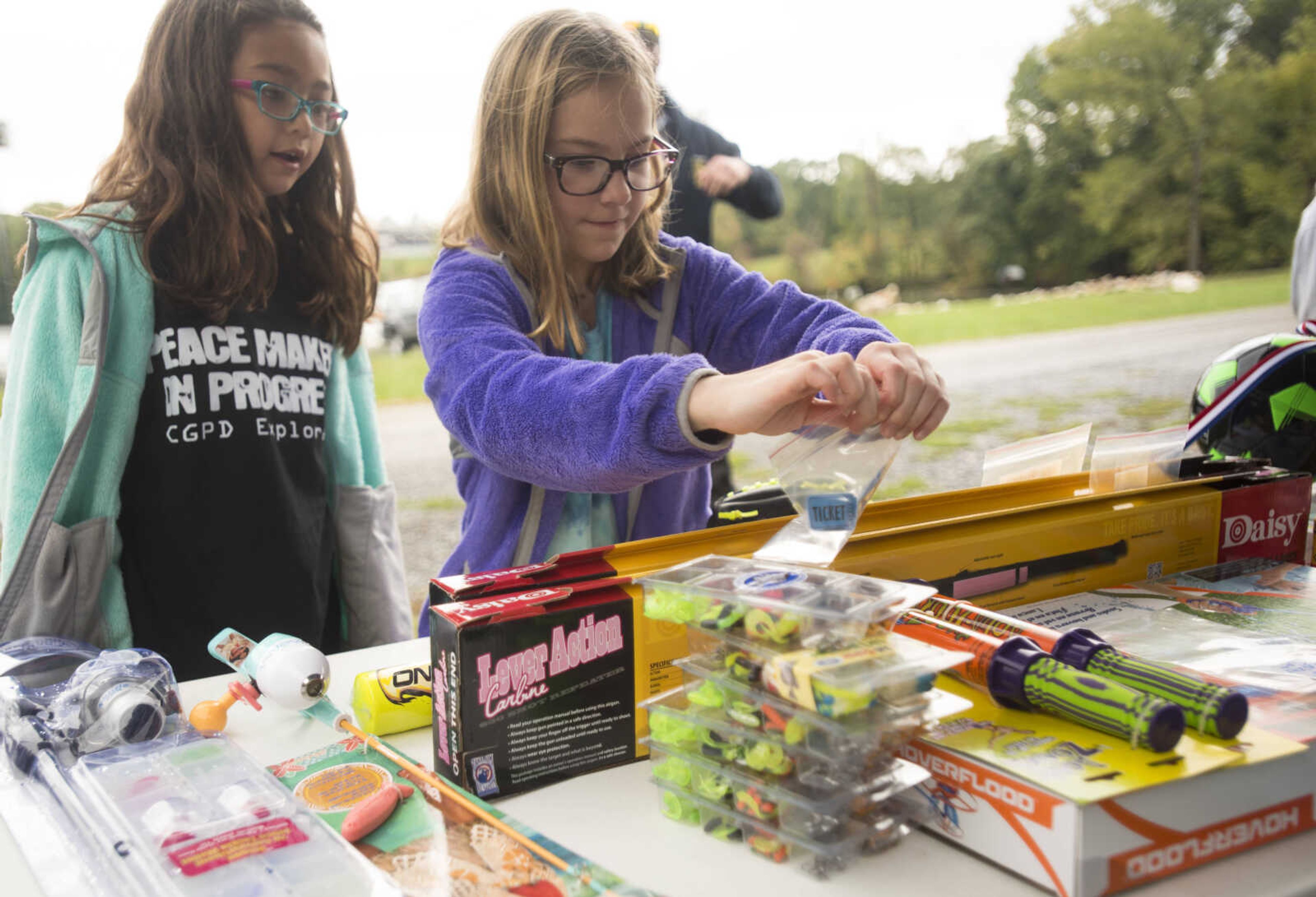 Children choose from prizes to win with raffle tickets at the inaugural Fishing Rodeo held Oct. 15, 2017 at Elks Lake in Cape Girardeau.