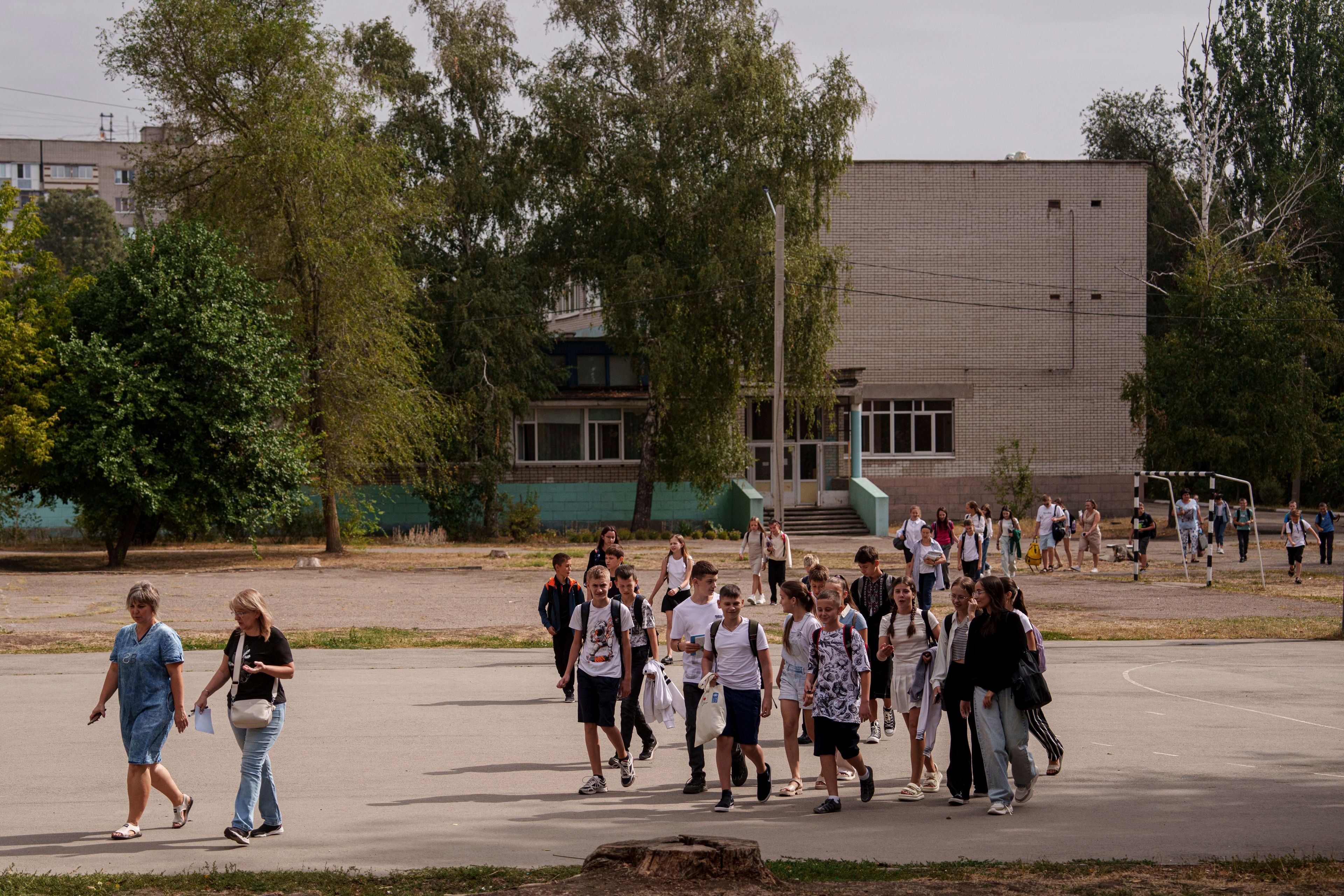 Children from Gymnasium No. 6 go to the school basement to continue their studies during an air alert in Zaporizhzhia, Ukraine, Sept. 3, 2024. (AP Photo/Evgeniy Maloletka)