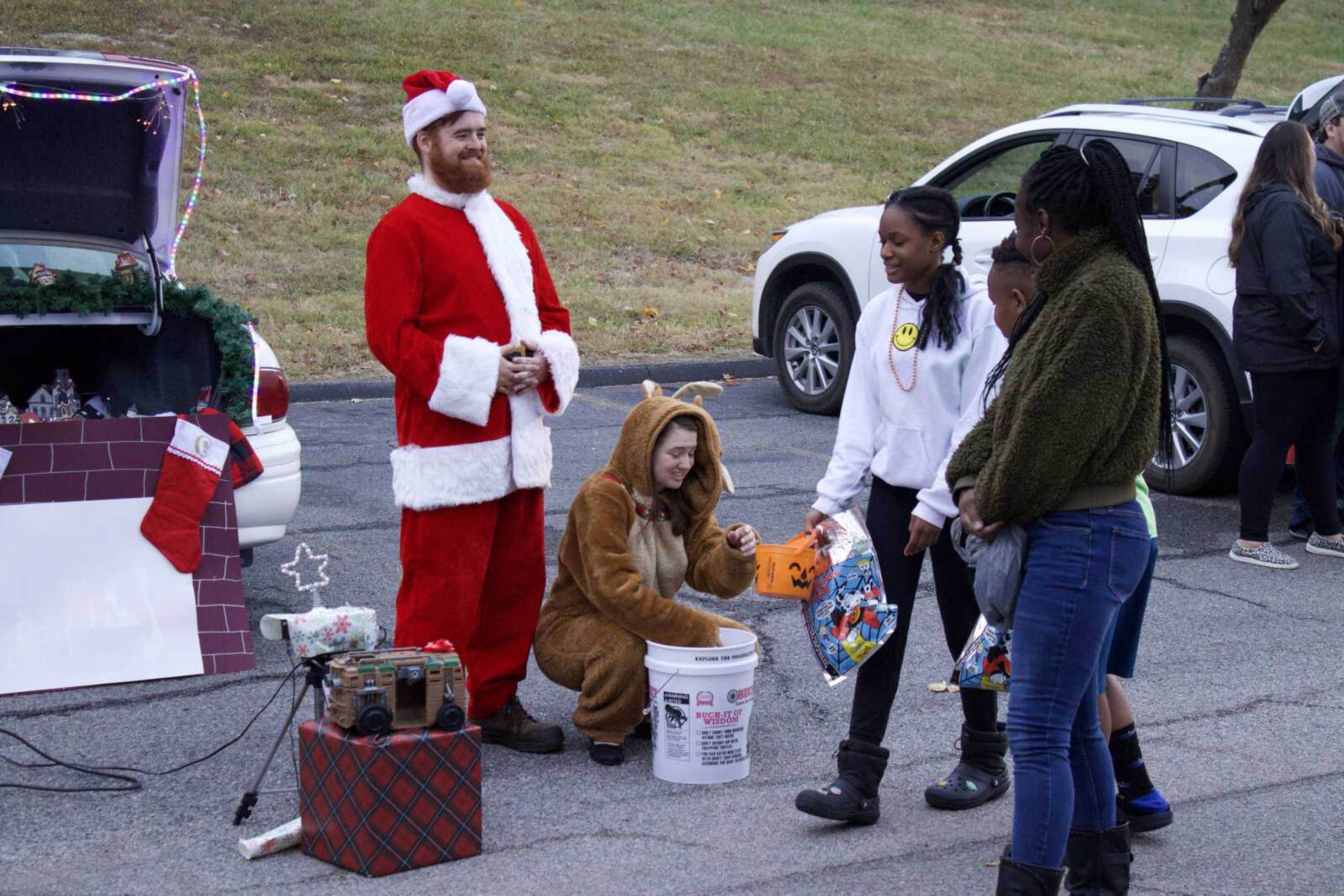 Sam and Clare Weaver dressed up as Santa and a reindeer on Monday, Oct. 31 at Lynwood Baptist Church. They played classic Christmas songs at their station and dressed their vehicle in Christmas lights. (Photo by Jeffery Long)