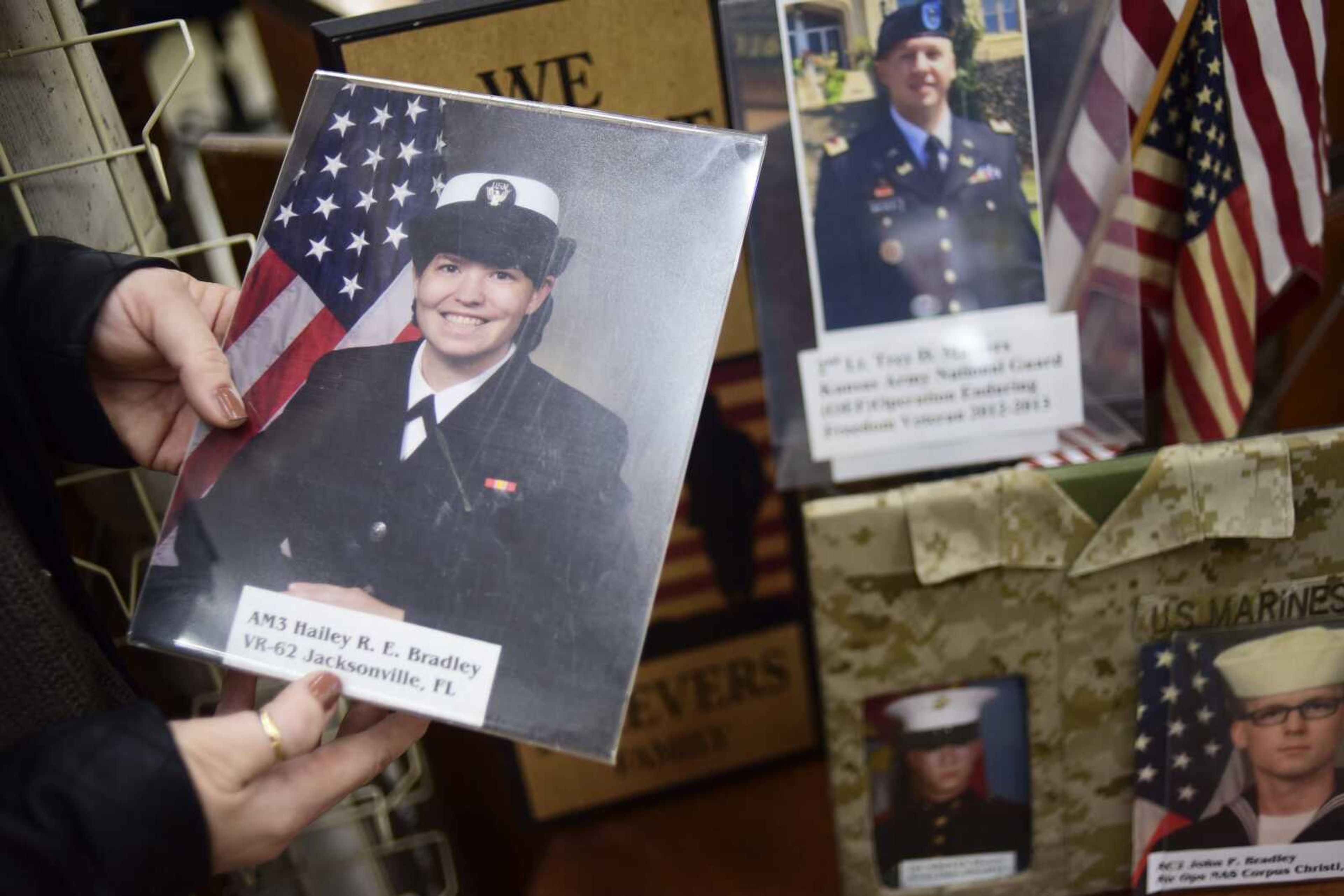 Deb Maevers holds a photo of her daughter Hailey R. E. Bradley at Pastimes Antiques Wednesday in Cape Girardeau.