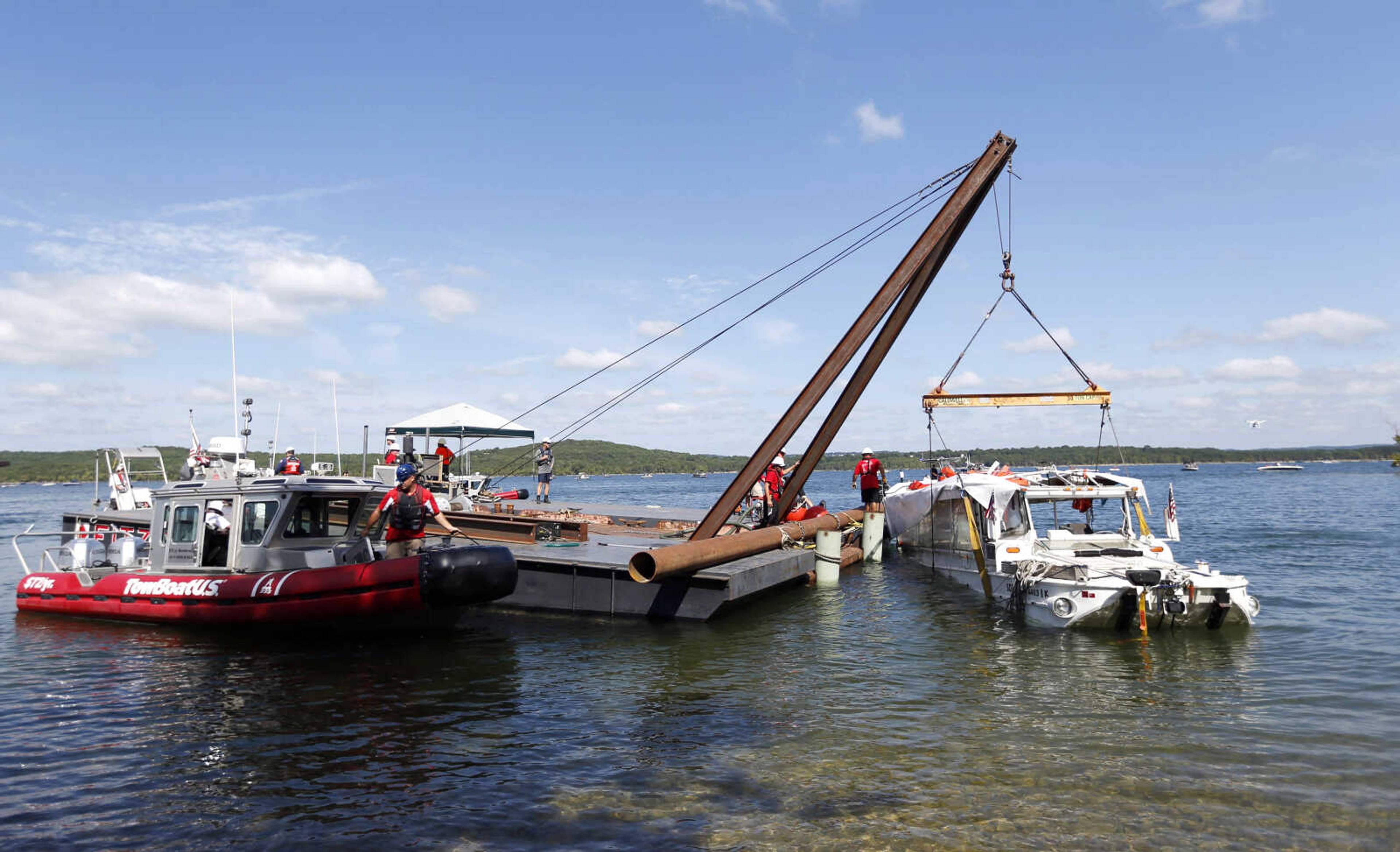 The duck boat that sank in Table Rock Lake in Branson, Missouri, is raised Monday.