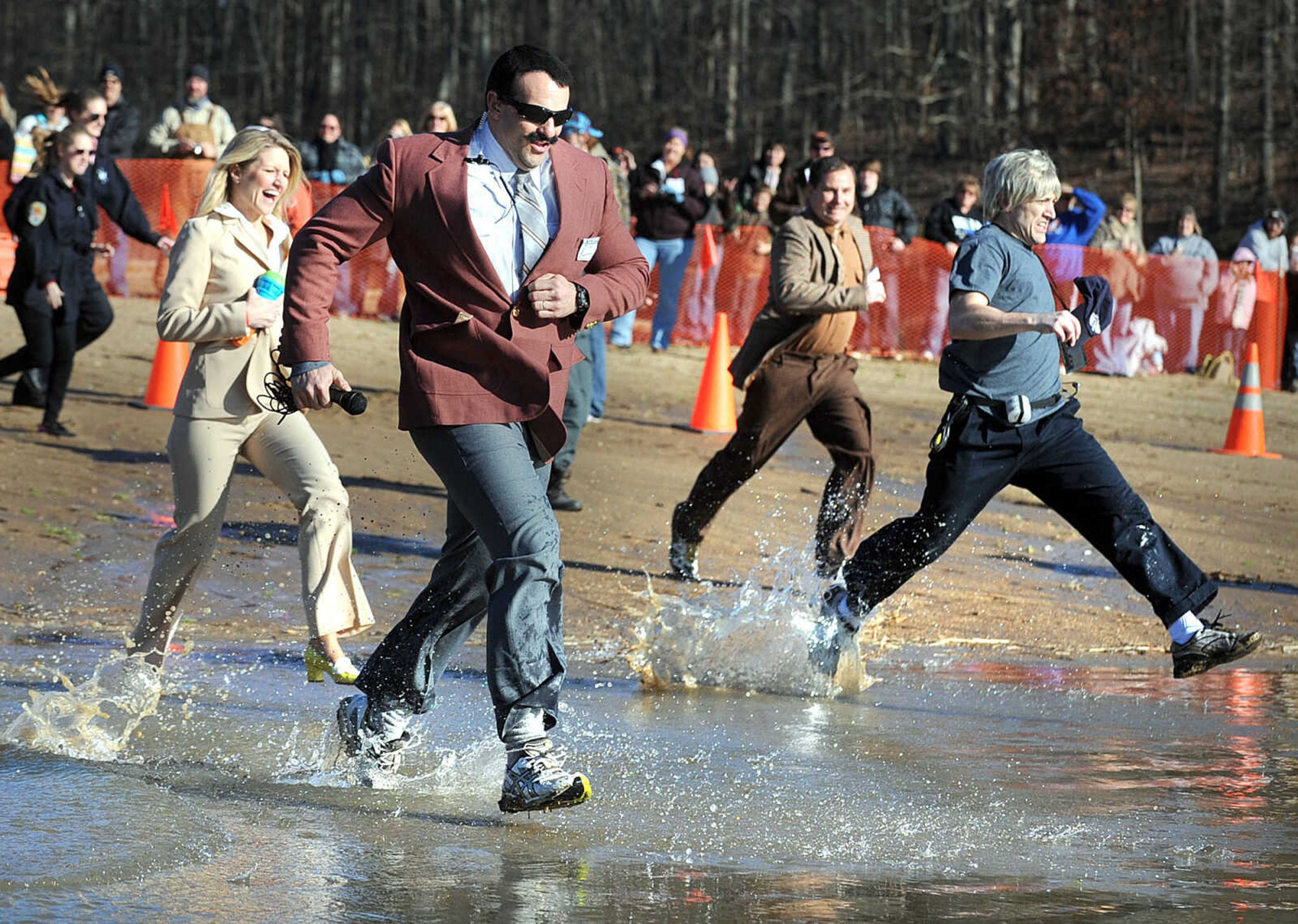 LAURA SIMON ~ lsimon@semissourian.com
People plunge into the cold waters of Lake Boutin Saturday afternoon, Feb. 2, 2013 during the Polar Plunge at Trail of Tears State Park. Thirty-six teams totaling 291 people took the annual plunge that benefits Special Olympics Missouri.