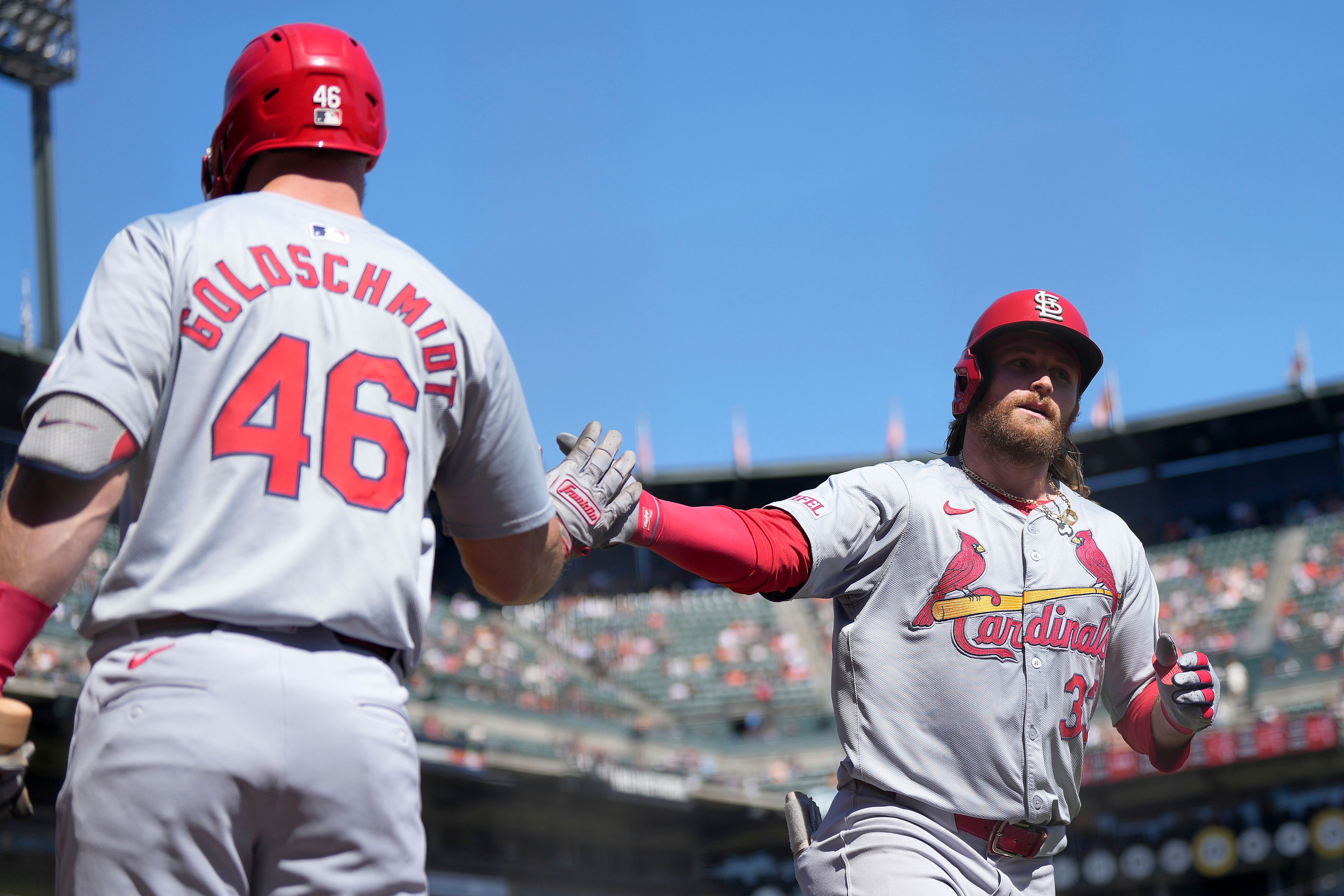 St. Louis Cardinals' Brendan Donovan, right, is congratulated by Paul Goldschmidt (46) after hitting a solo home run during the third inning of a baseball game against the San Francisco Giants, Sunday, Sept. 29, 2024, in San Francisco. (AP Photo/Tony Avelar)