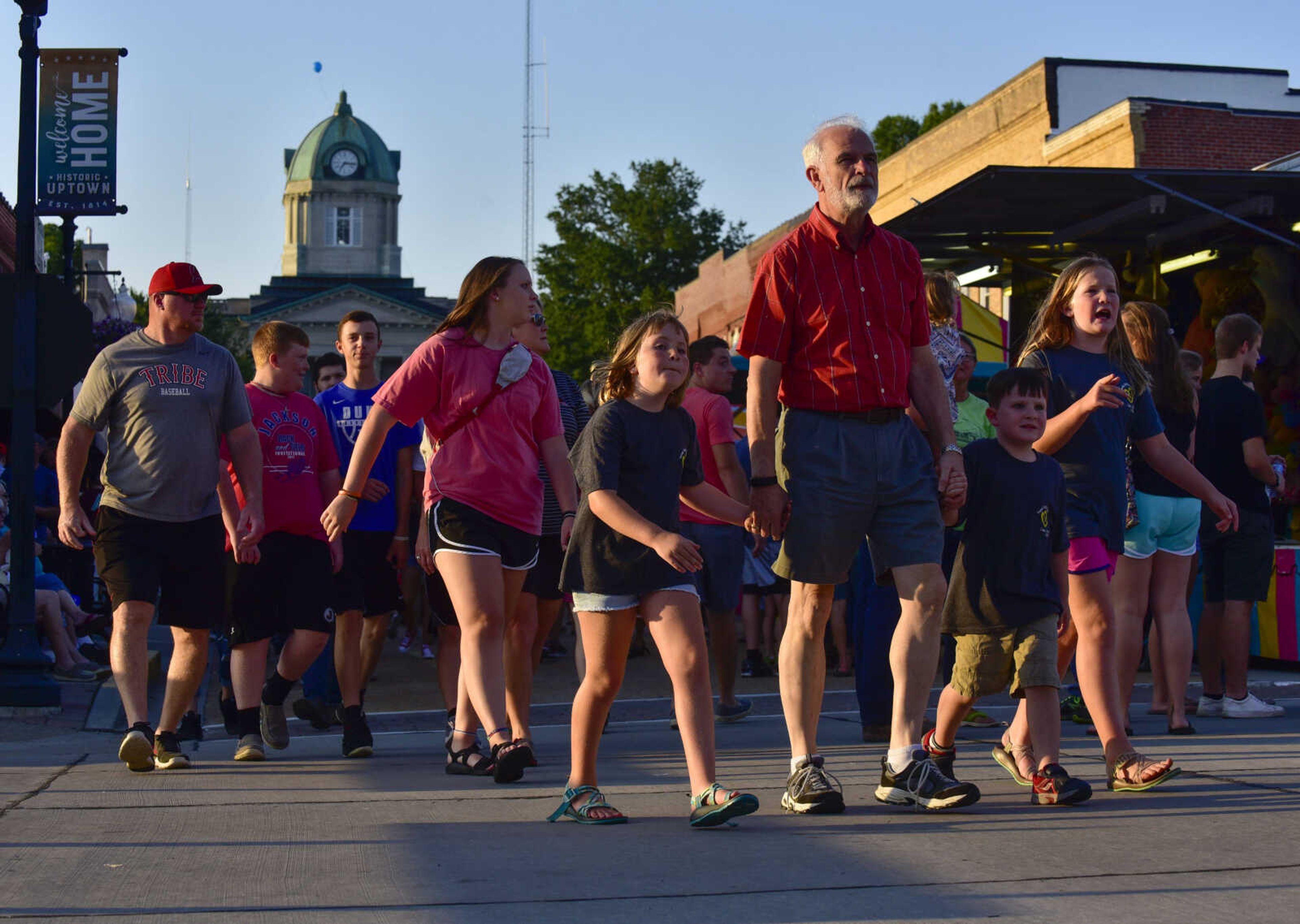 Visitors walk along South High Street during Homecomers on Friday, July 28, 2018 in Jackson.