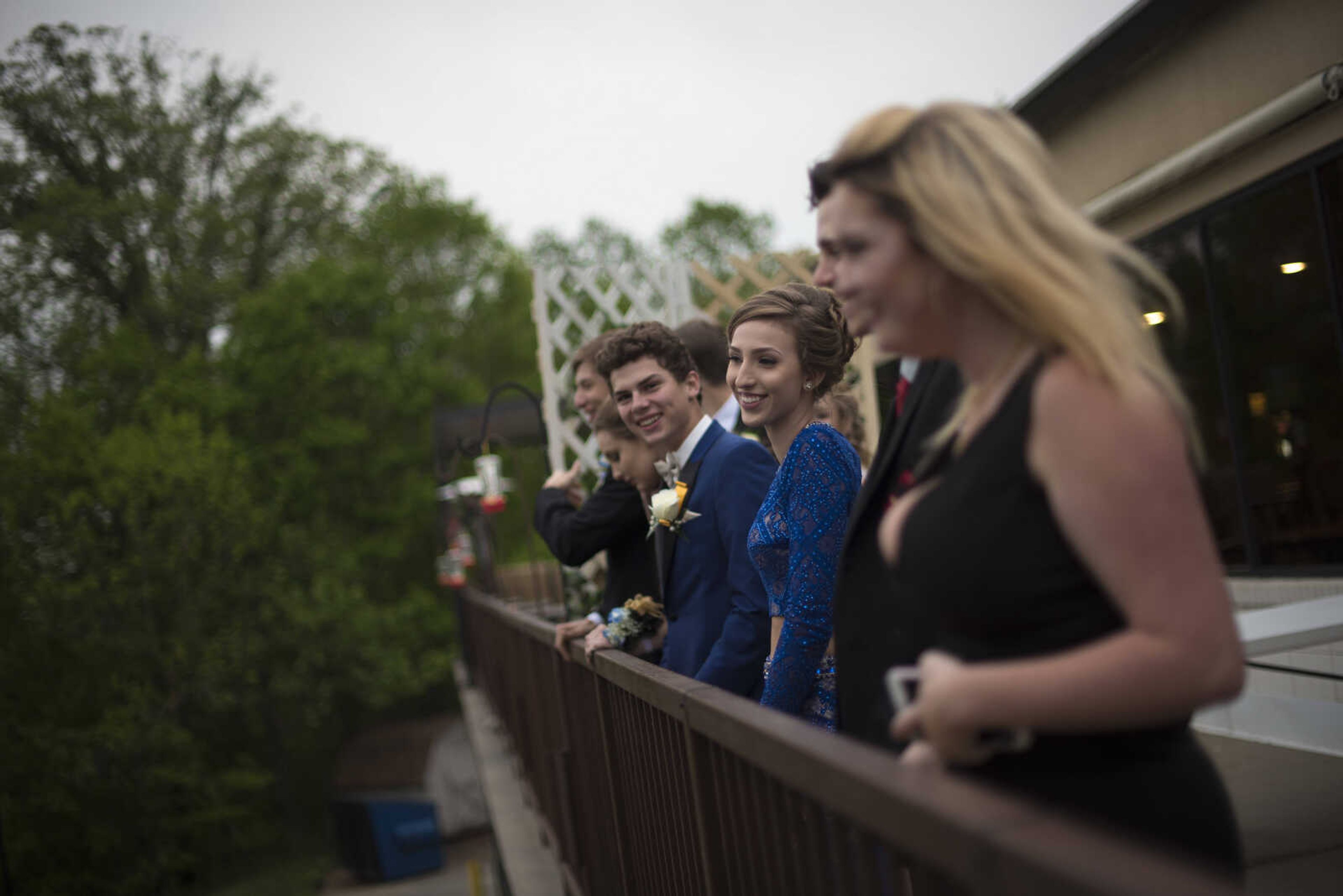 Students lean over on the balcony during the Saxony Lutheran prom Saturday, April 22, 2017 at the Elk's Lodge in Cape Girardeau.