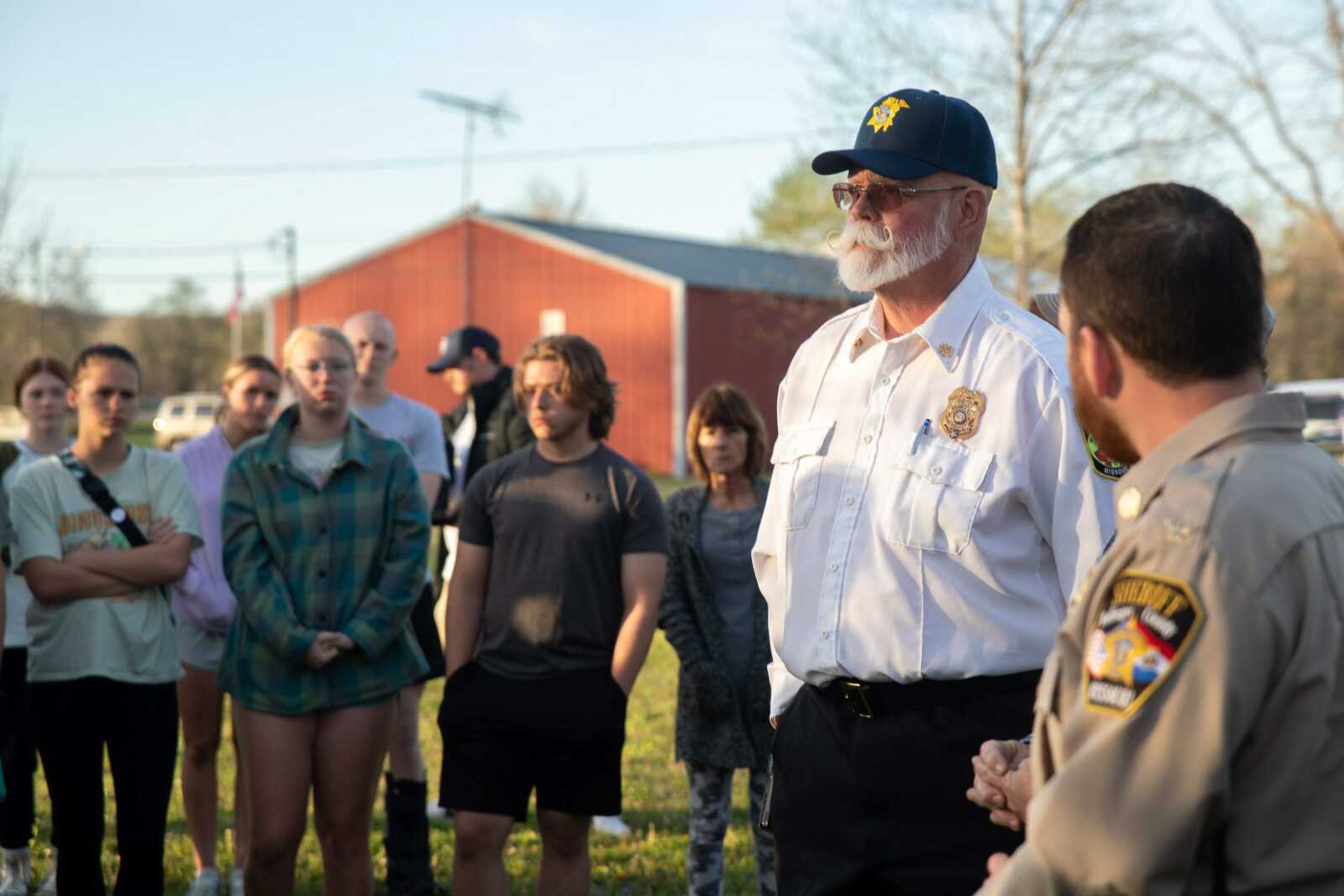 Calvin Troxell, Woodland Fire Protection District chief and Bollinger County coroner, addresses the crowd at the prayer vigil April 5 in Bollinger County.