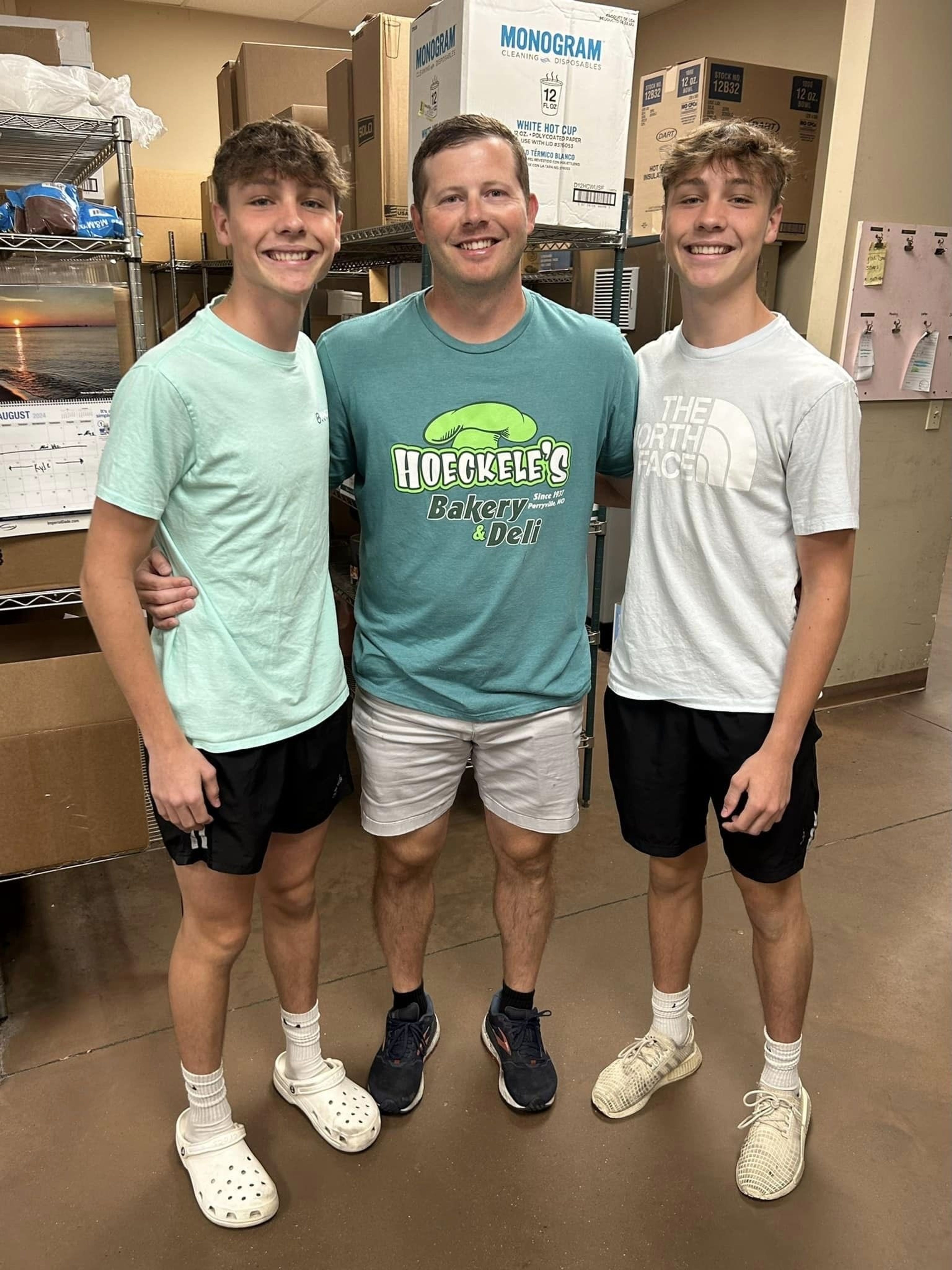 Eli Hoeckele and his twin sons Preston, left, and Porter, constitute some of the fourth and fifth generation of workers at Hoeckele Bakery and Deli in Perryville. Eli Hoeckele and all his siblings worked there when they were younger, and starting in 2026 he and his cousin will take over official ownership. 