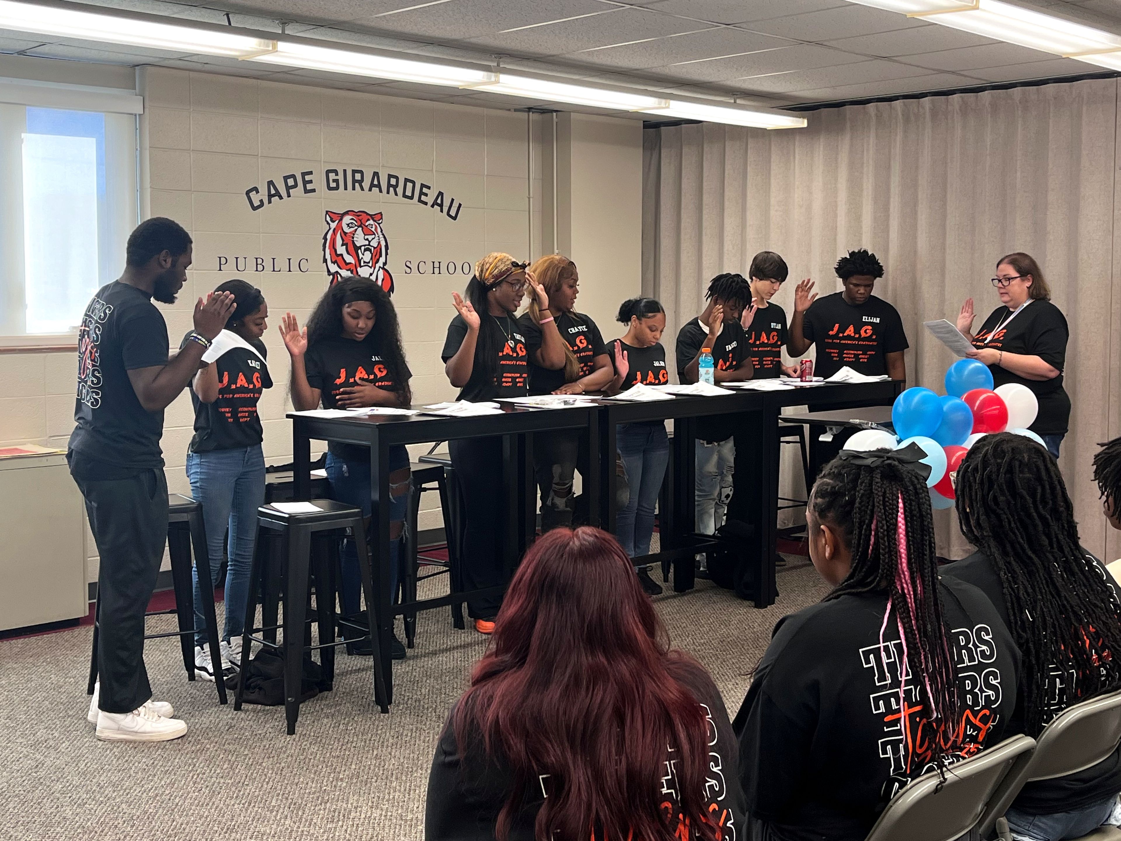 Cape Girardeau Central Academy's JAG specialist Nichole Buehrle, far right,  swears in the new officers during the program's installment ceremony Wednesday, Oct. 2, at Cape Girardeau Public Schools' Central Administrative Offices. Officers pictured, from left: Jaiden Moore, Kaylei Carter-Long, Jael Jones, Taylor Banks, Chalyce Horrell, Jalayah Francis, D'Angelo Wiggins, Dylan Davidson and Elijah King. Not pictured: Sofia Smith.