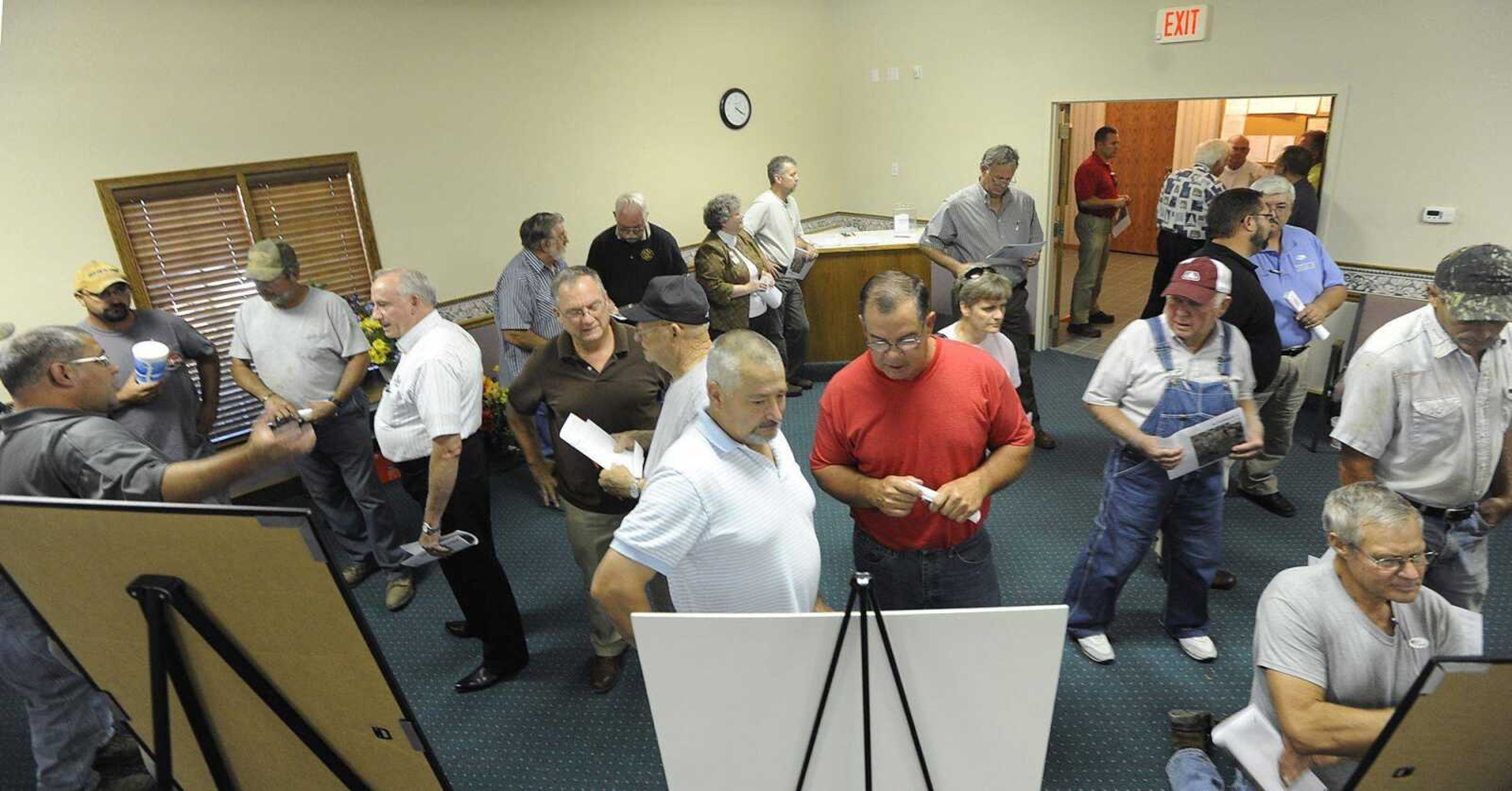 Dozens of people learn about and comment on different options for the proposed Scott City interchange Tuesday at Scott City City Hall. (ADAM VOGLER)