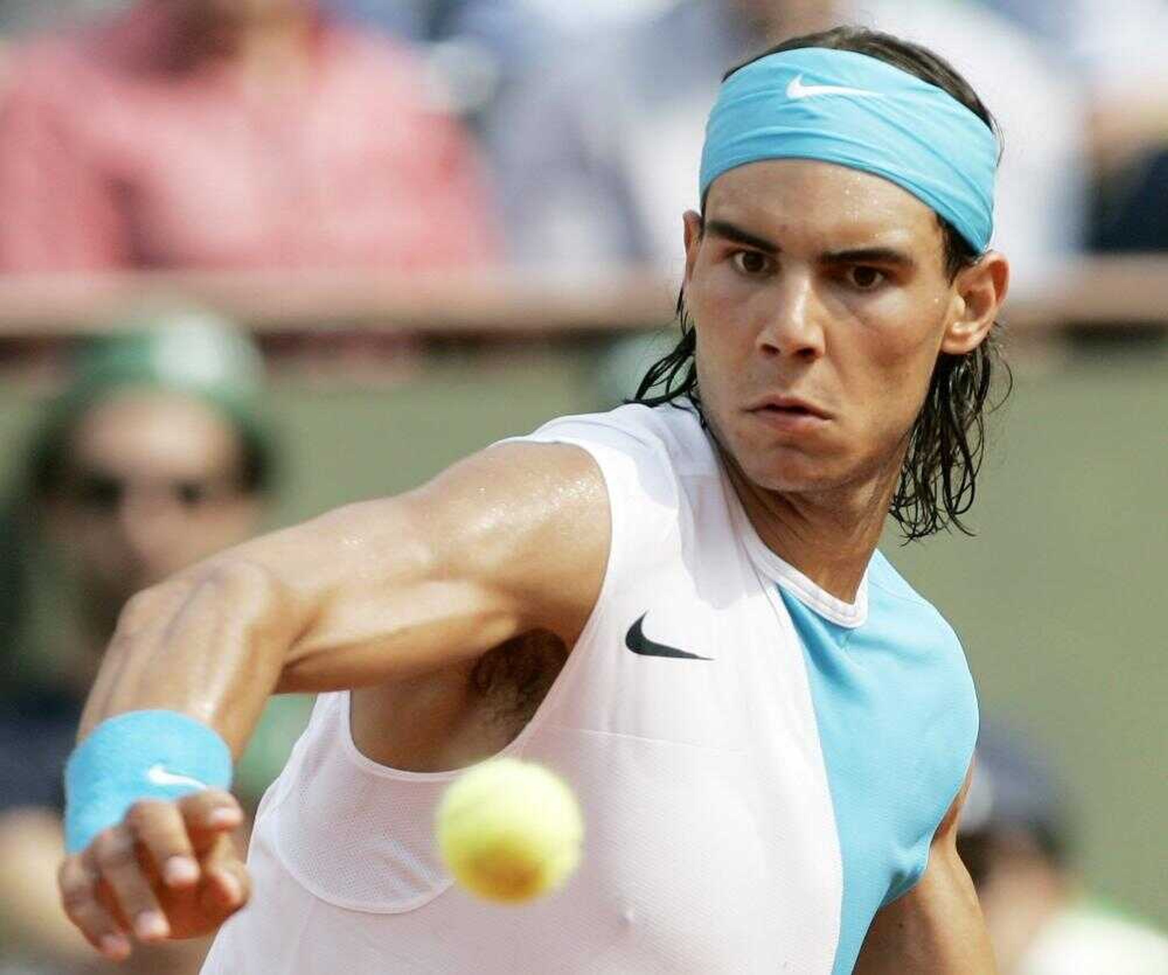 Defending champion Spain's Rafael Nadal eyes the ball as he plays Australia's Lleyton Hewitt during their fourth round match of the French Open tennis tournament at the Roland Garros stadium in Paris, Monday, June 4, 2007. (AP Photo/Francois Mori)