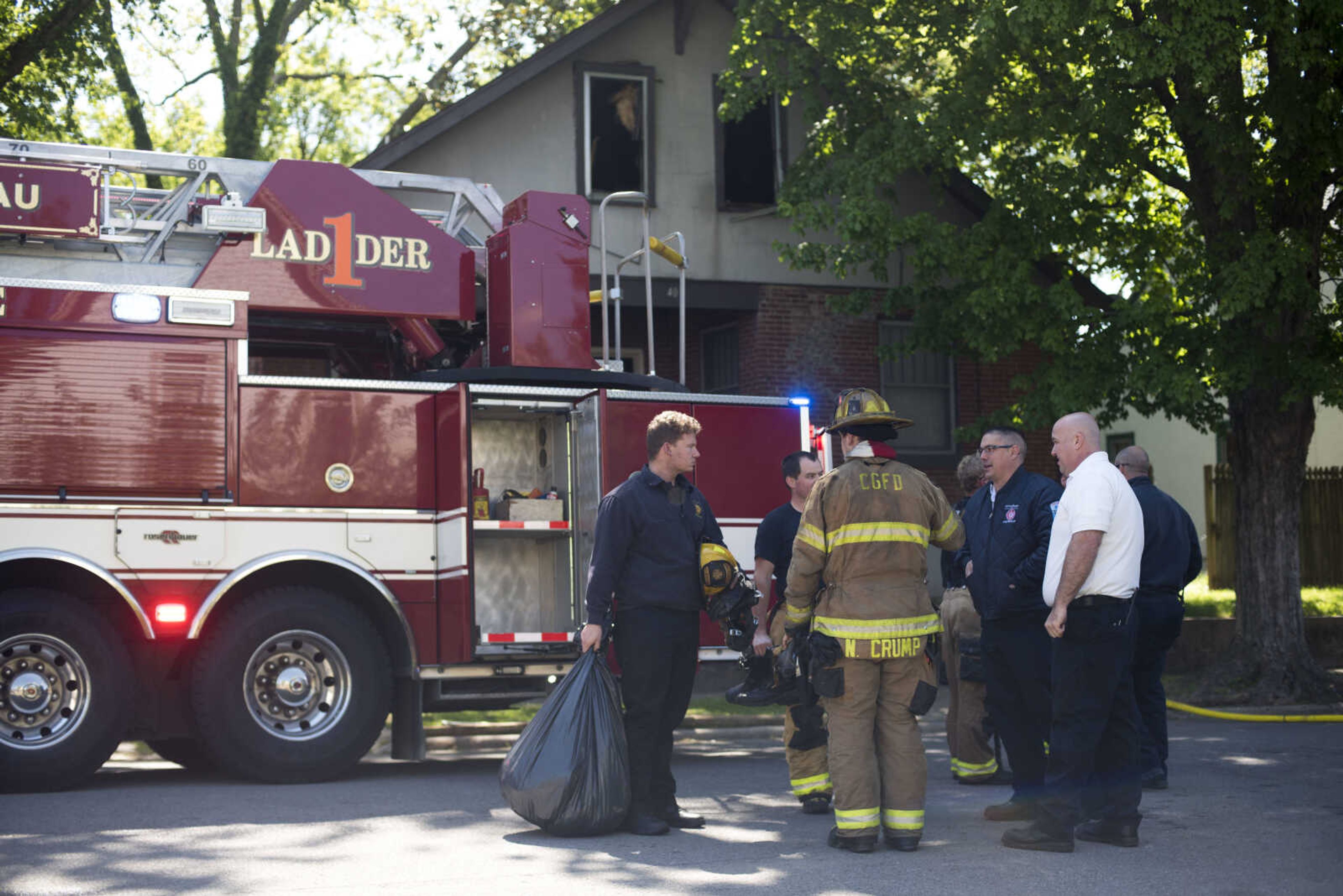 Members of the Cape Girardeau Fire Department respond to the scene of a structure fire Monday, May 11, 2020, at 40 North Henderson Ave. in Cape Girardeau.