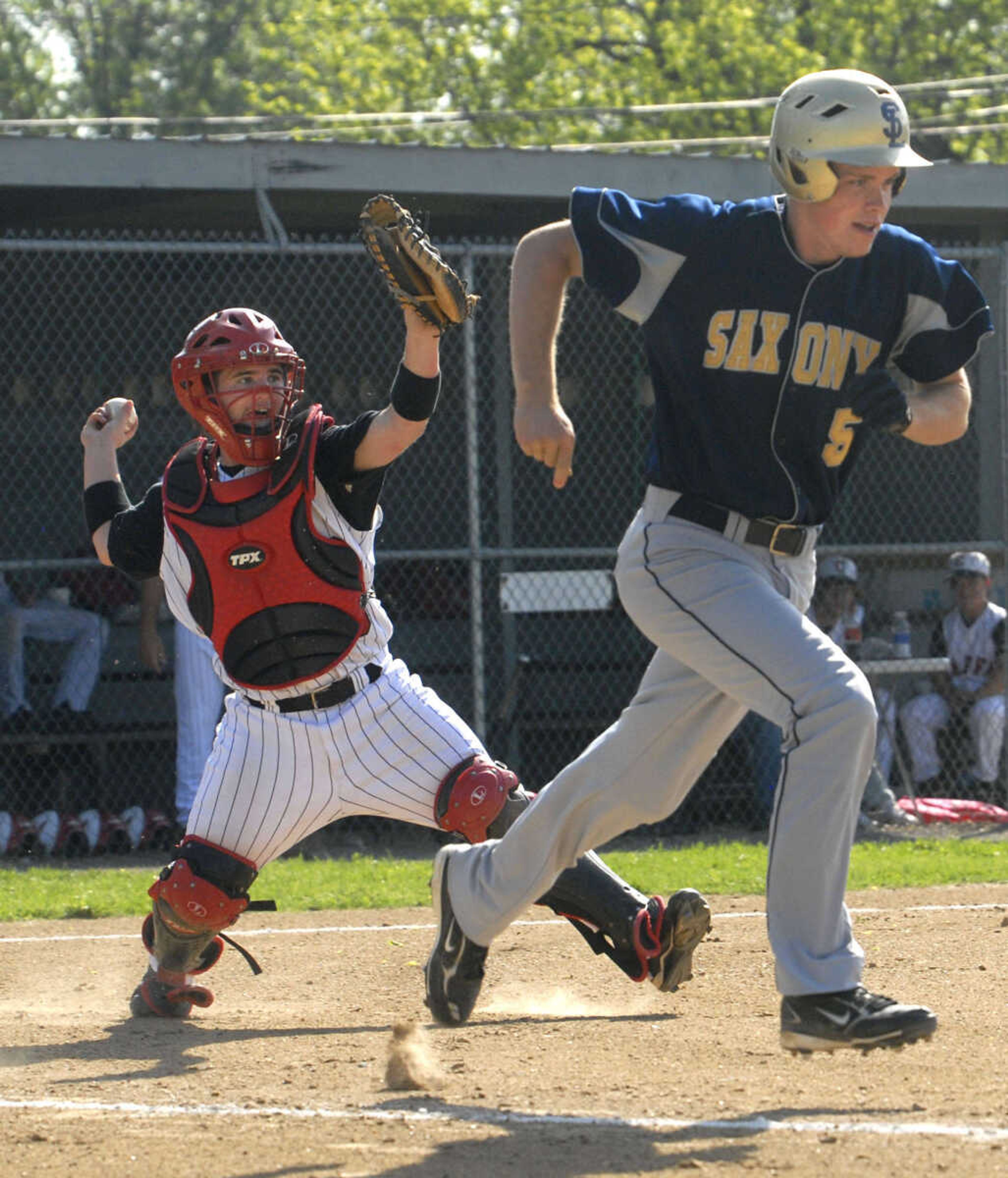 Chaffee catcher Trevor Cannon picks up a short hit and throws out Saxony Lutheran's Garrett Fritsche in the third inning Thursday at Chaffee.