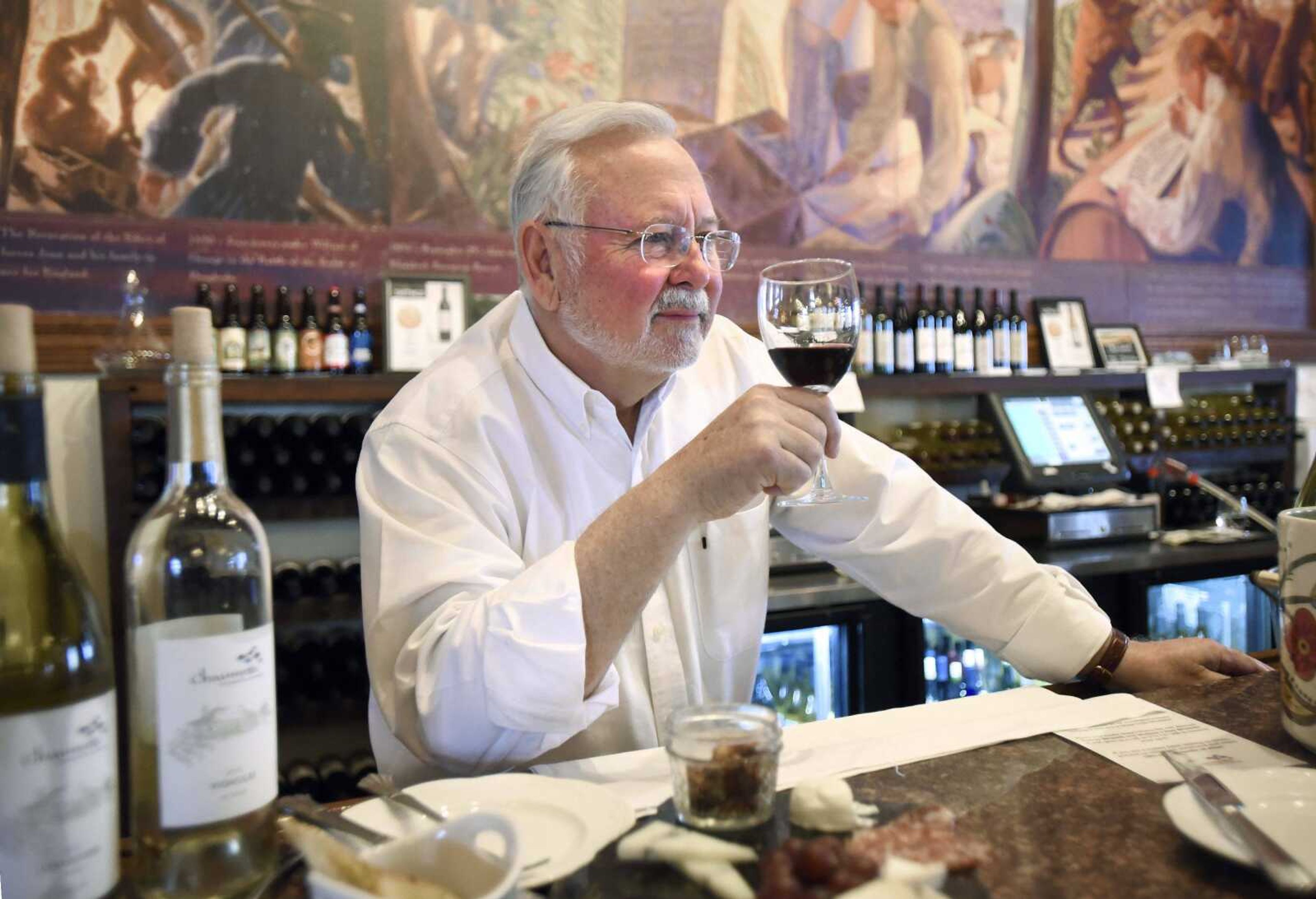 LAURA SIMON ~ lsimon@semissourian.com    Hank Johnson, owns of Chaumette Vineyards & Winery, holds a sample of the 2015 Chambourcin Reserve in the tasting room on Friday, March 17, 2017, in Ste. Genevieve, Missouri.