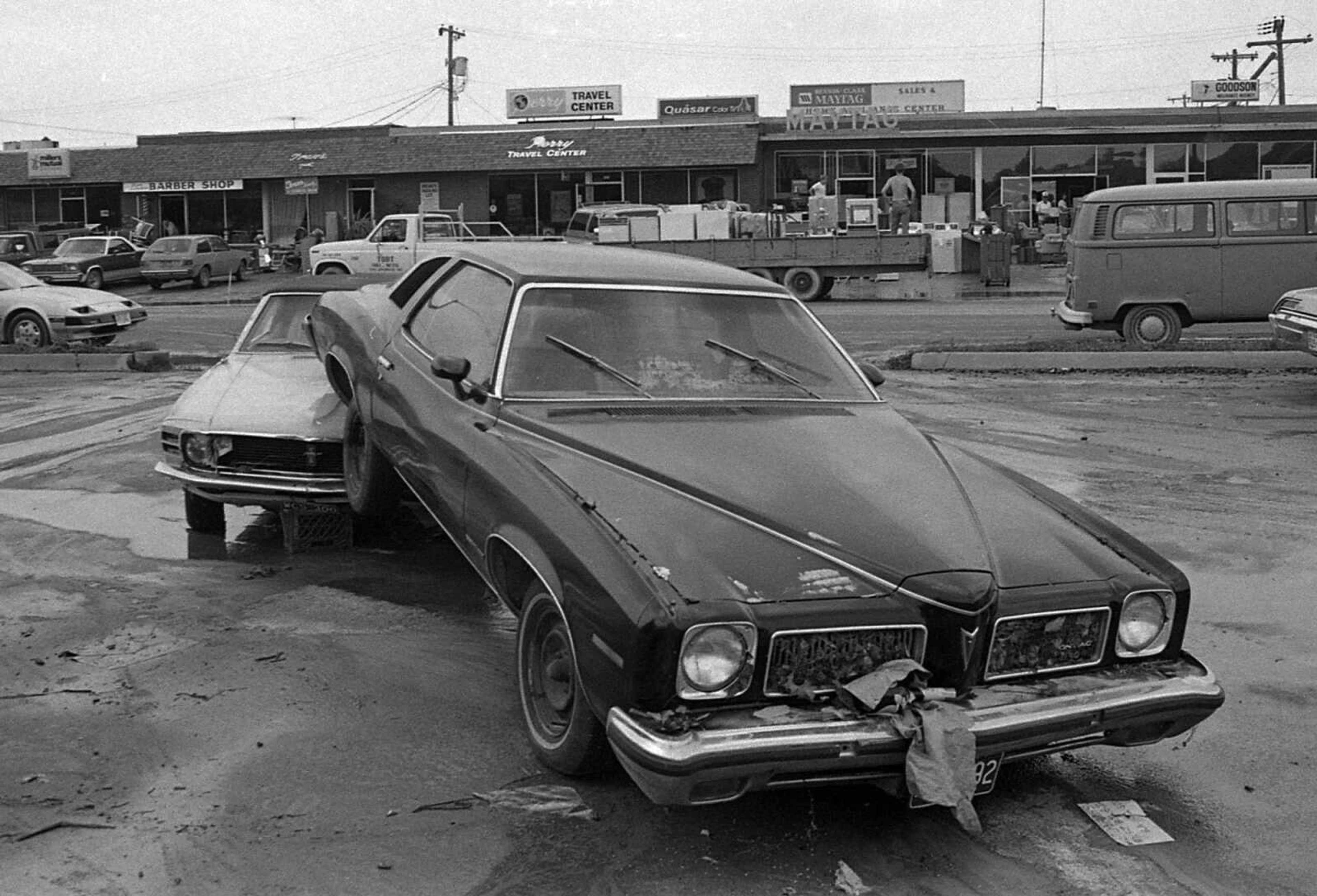 Receding floodwaters left one car on another near Plaza Way off William Street on May 16, 1986. (Southeast Missourian)