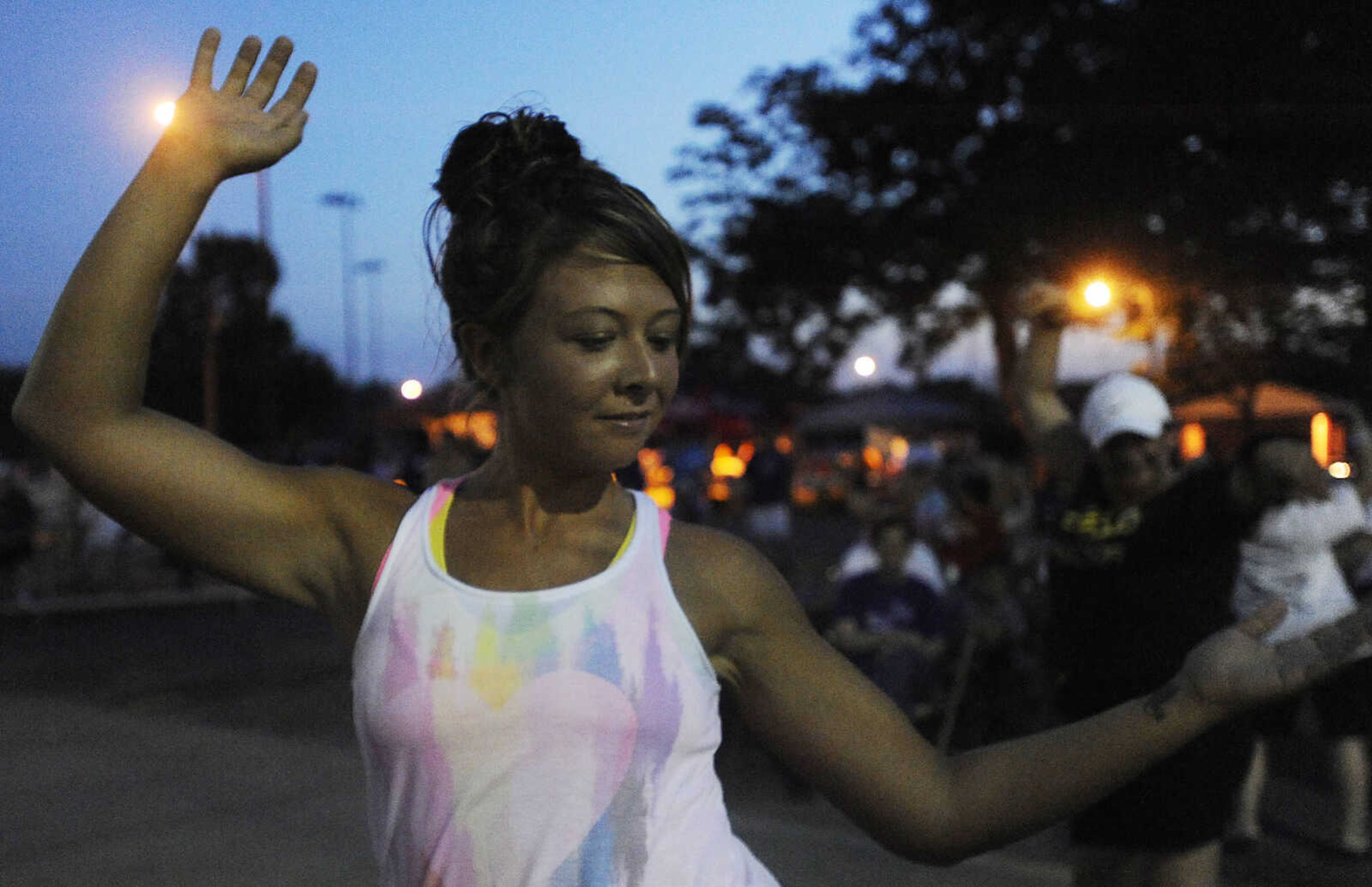 Jaimie Lynn participates in a Zumba class at the Relay for Life of Cape Girardeau County, Friday, June 14, at Arena Park in Cape Girardeau. This is the 15th year for the event, which serves to raise awareness about cancer while also serving as a fundraiser for the American Cancer Society. Participants form teams which raise money before and during the event.