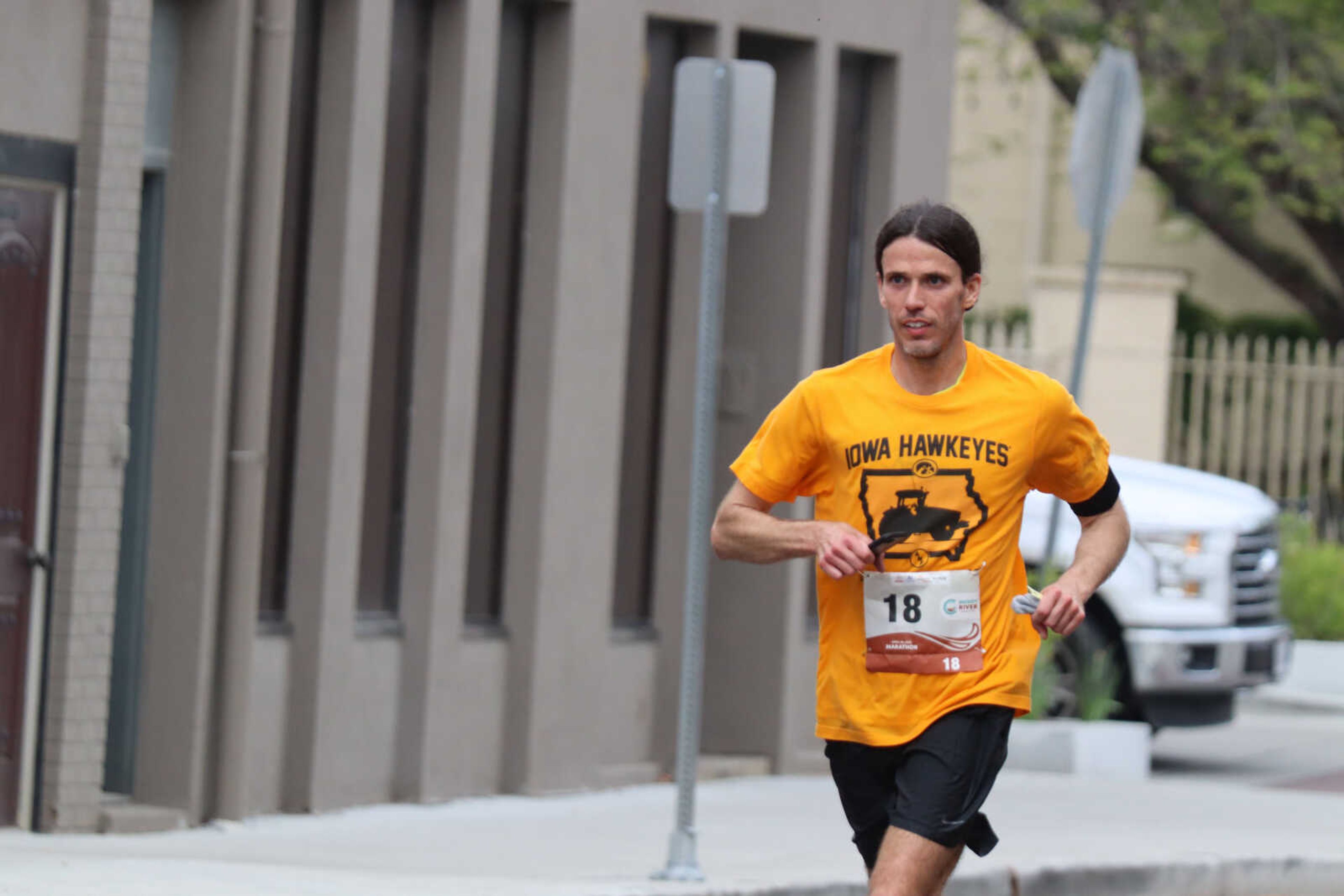 Jeremiah Gibbons running his way into third place of the Muddy River Marathon.