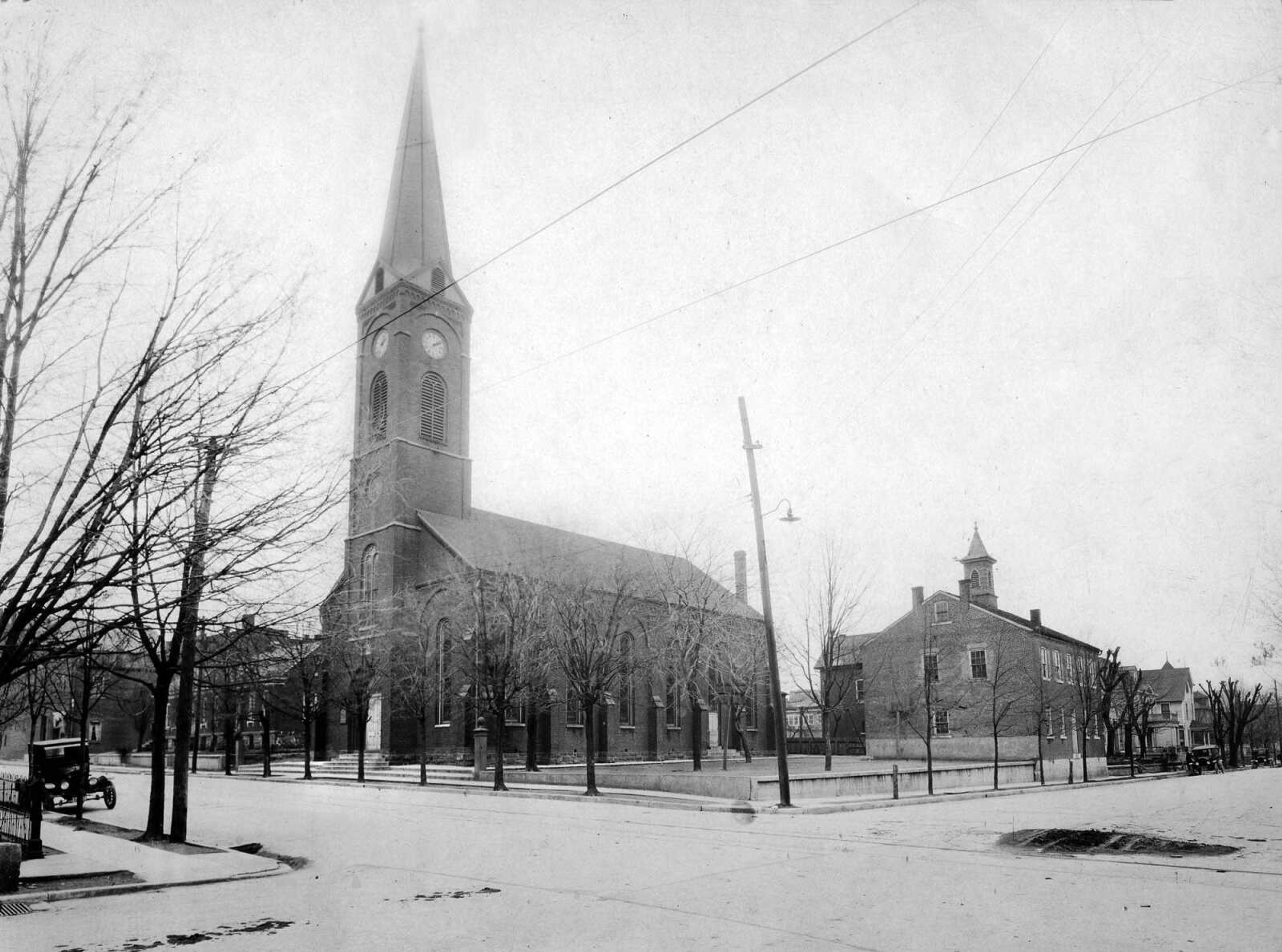 This early photograph of the original Trinity Lutheran Church in Cape Girardeau also shows Trinity Lutheran School nearby. The school building was constructed on Themis street in 1865. That building was used until 1925, when the present school on Pacific street was completed. Trinity Lutheran School opened Nov. 12, 1854, in a rented house that also was used for church services. Pastors served as teachers until the first full-time teacher was hired in 1859. A new church building was constructed at Frederick and Themis streets and dedicated on Nov. 2, 1879. The old church building was razed on April 18, 1979. A new church was built on the site and dedicated May 2, 1982.