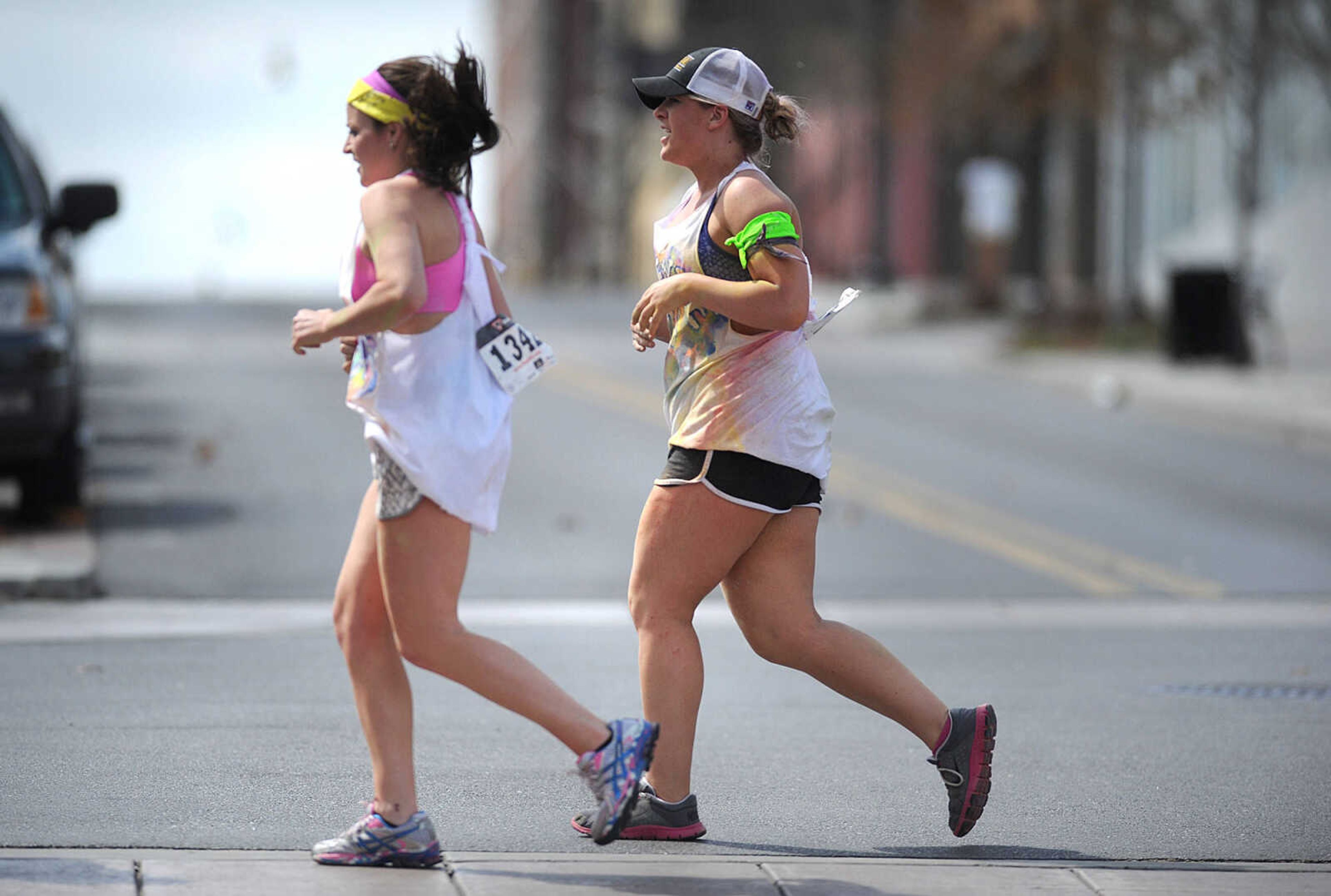 LAURA SIMON ~ lsimon@semissourian.com

Runner cross Broadway in the homestretch of the Color Me Cape 5K, Saturday, April 12, 2014, in downtown Cape Girardeau.