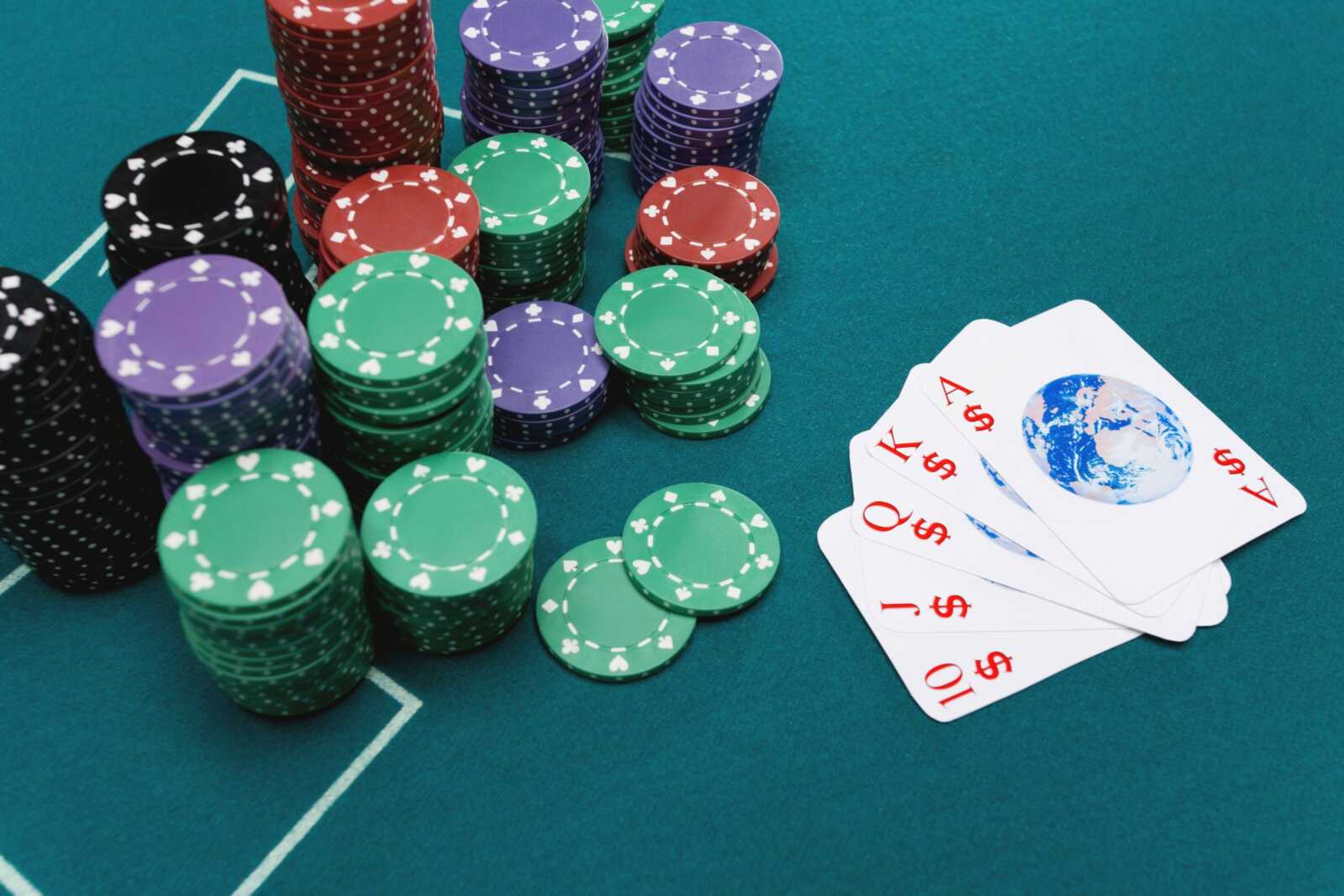 Globe playing cards with poker chips