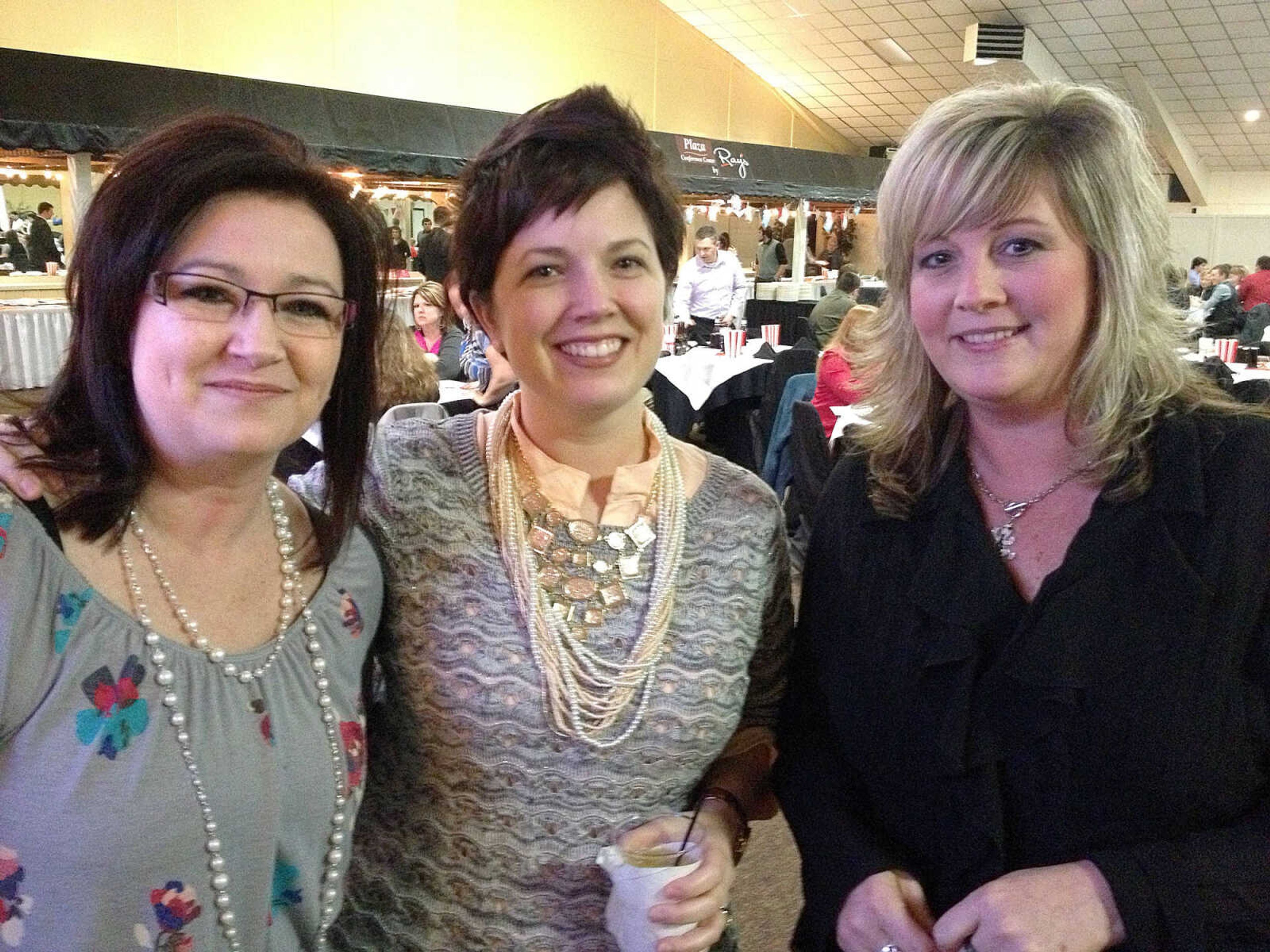 Dana Hukel, left, and Gina Robinson, both with BOLD Marketing, and Cindy Garland with Saint Francis Medical Center.