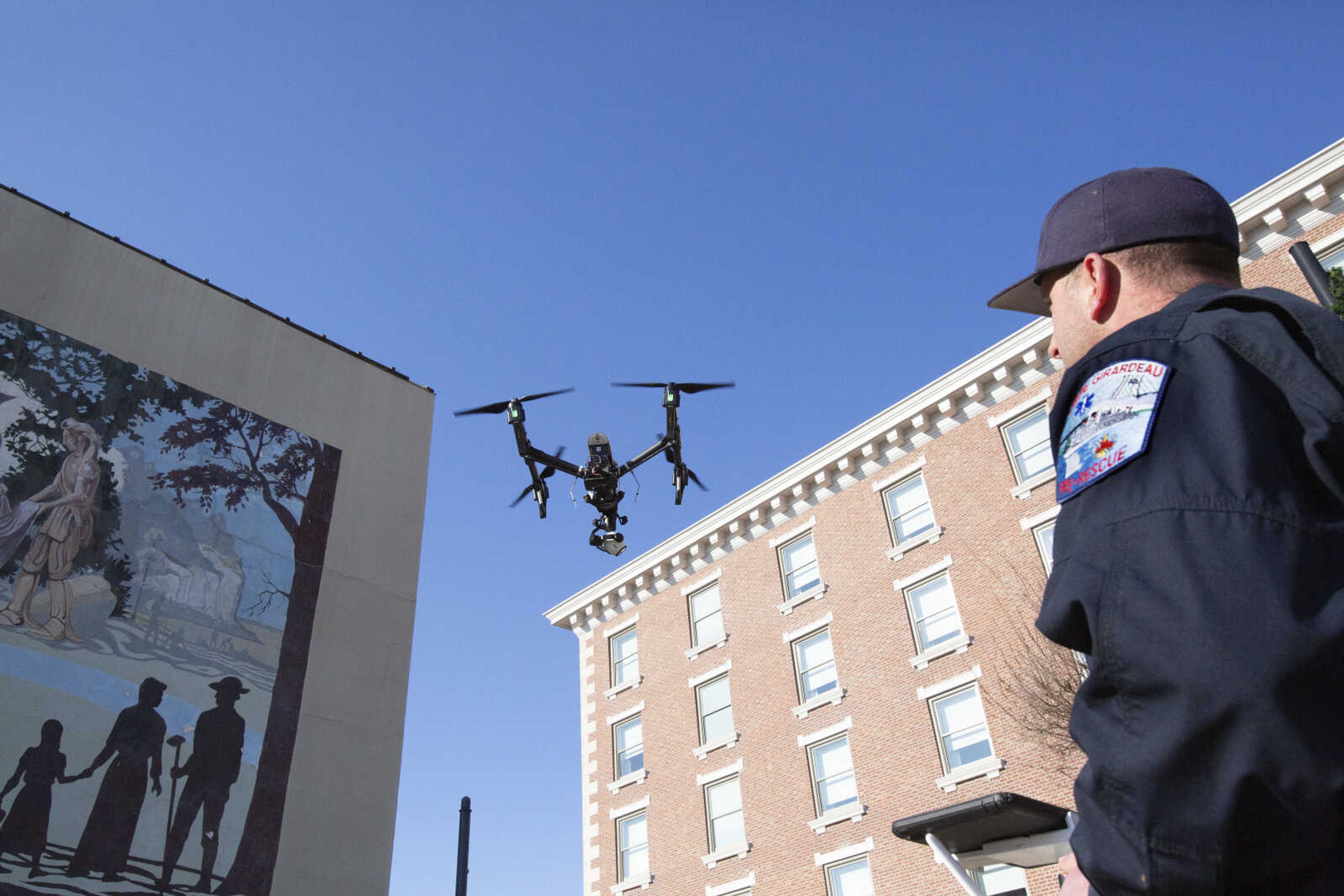 Dewayne McAlister, Cape Girardeau Fire Department captain paramedic, flies a drone in downtown Cape Girardeau. The City of Cape Girardeau has purchased two drones for use by the fire and police departments.