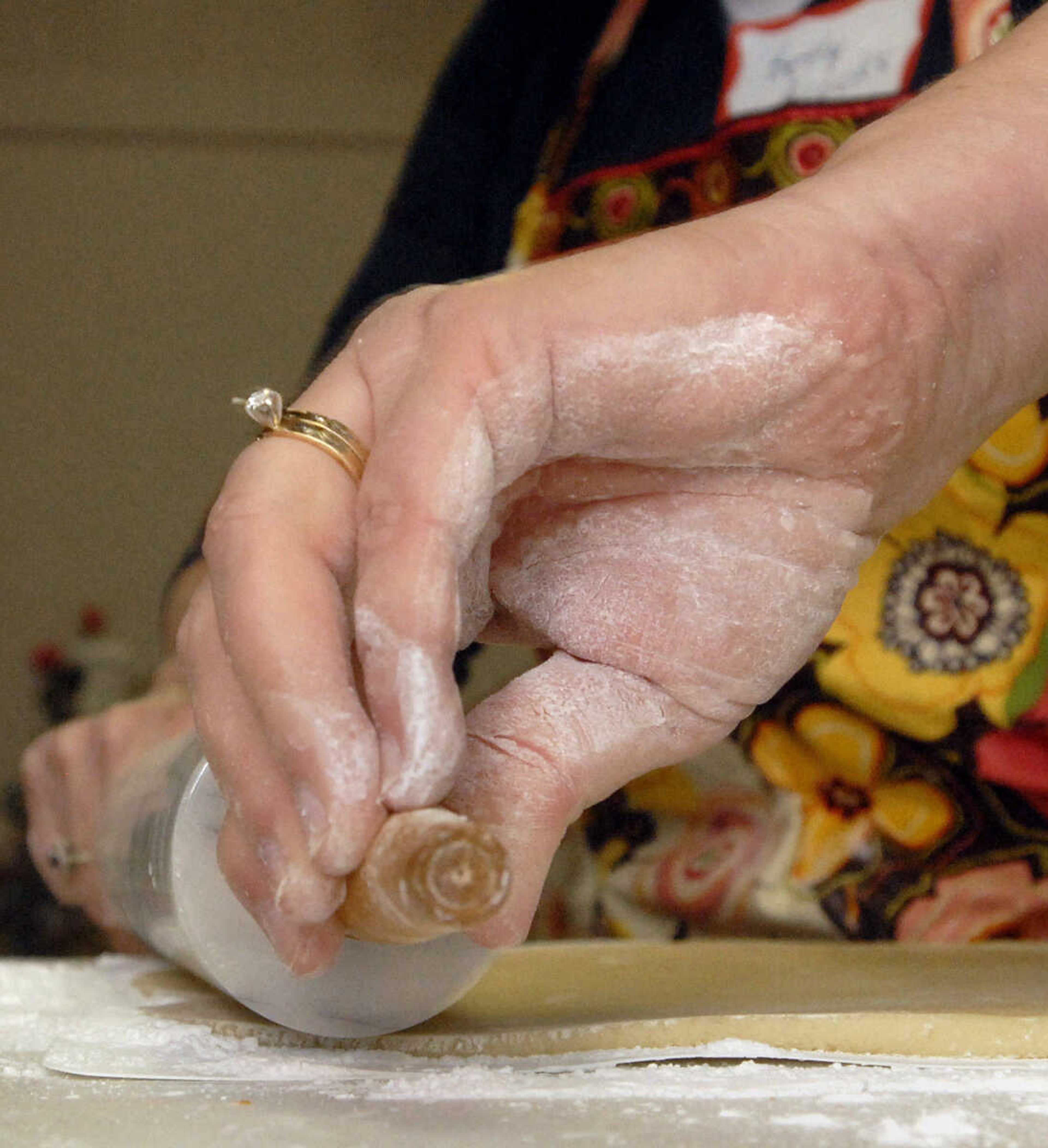 LAURA SIMON~lsimon@semissourian.com
Marzipan is carefully rolled out into thin sheets to top petit fours Saturday, February 5, 2011.