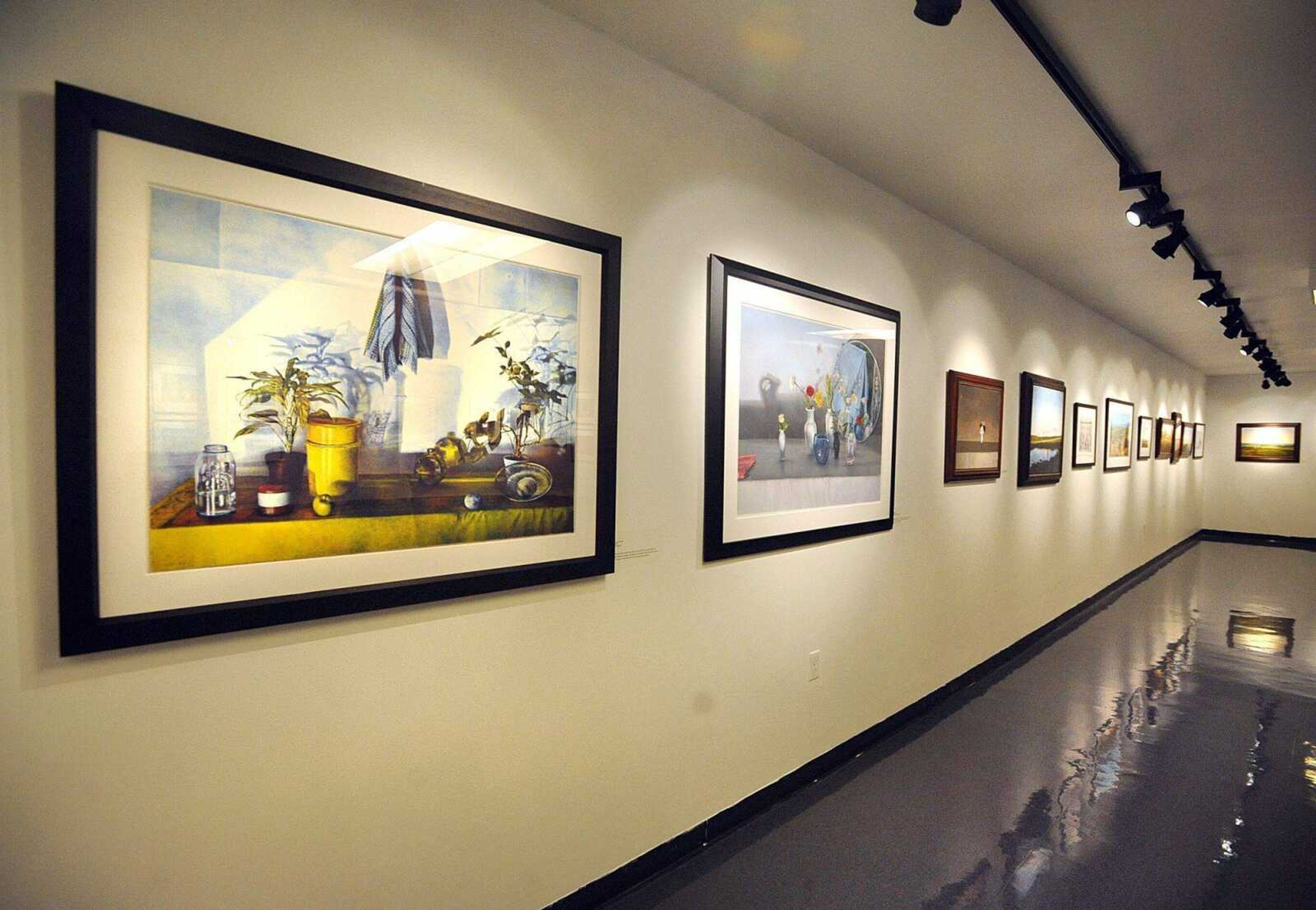 A collection of lithographs, oil paintings and graphite drawings by James D. Butler on display in the River Campus Art Gallery of Southeast Missouri State University. (Laura Simon)