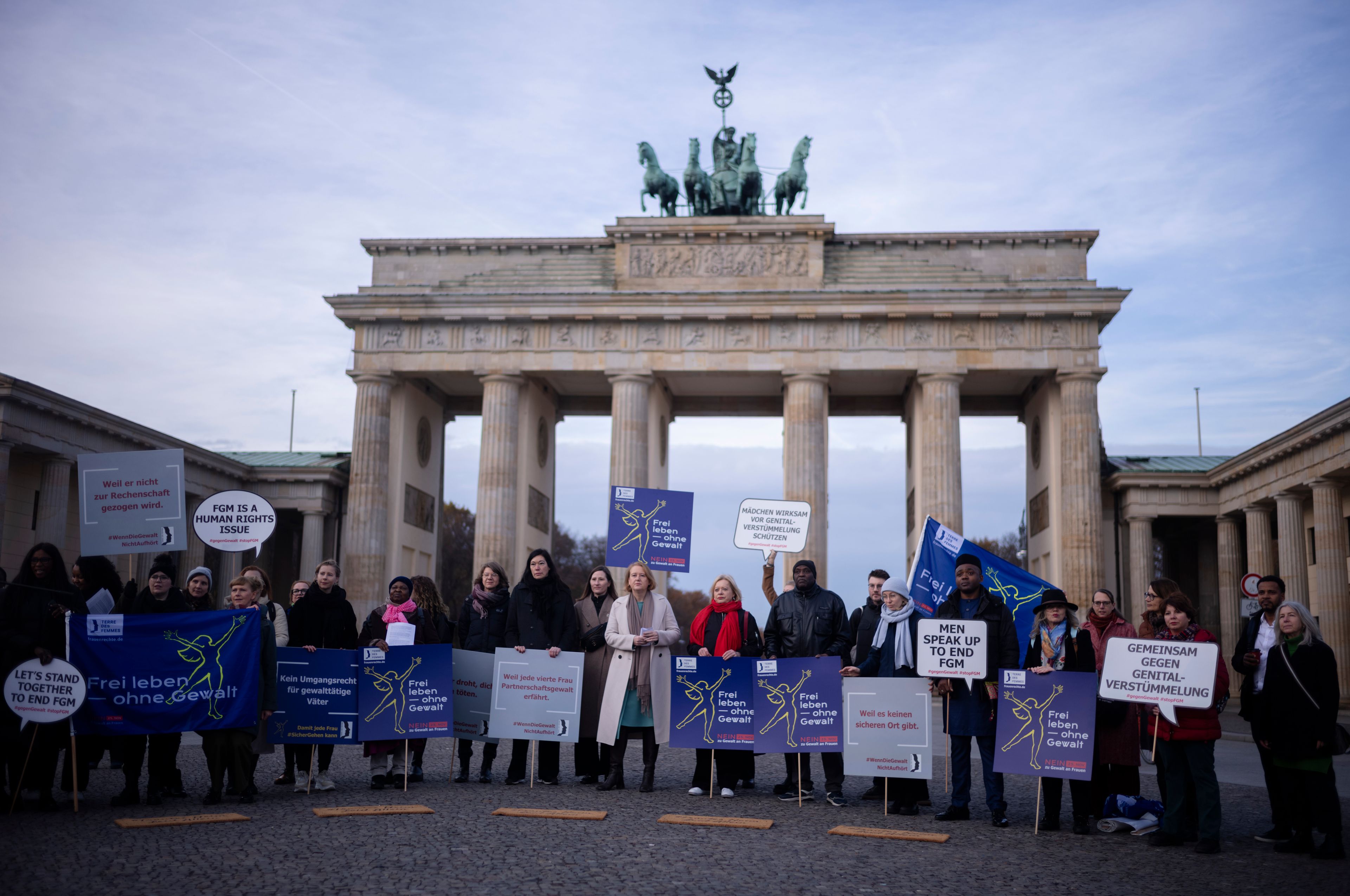 Women attend a protest of the Terre des Femmes human rights organisation together with German Minister for Family Affairs, Senior Citizens, Women and Youth, Lisa Paus, center, to mark the International Day for the Elimination of Violence Against Women in front of the Brandenburg Gate in Berlin, Germany, Monday, Nov. 25, 2024. (AP Photo/Markus Schreiber)