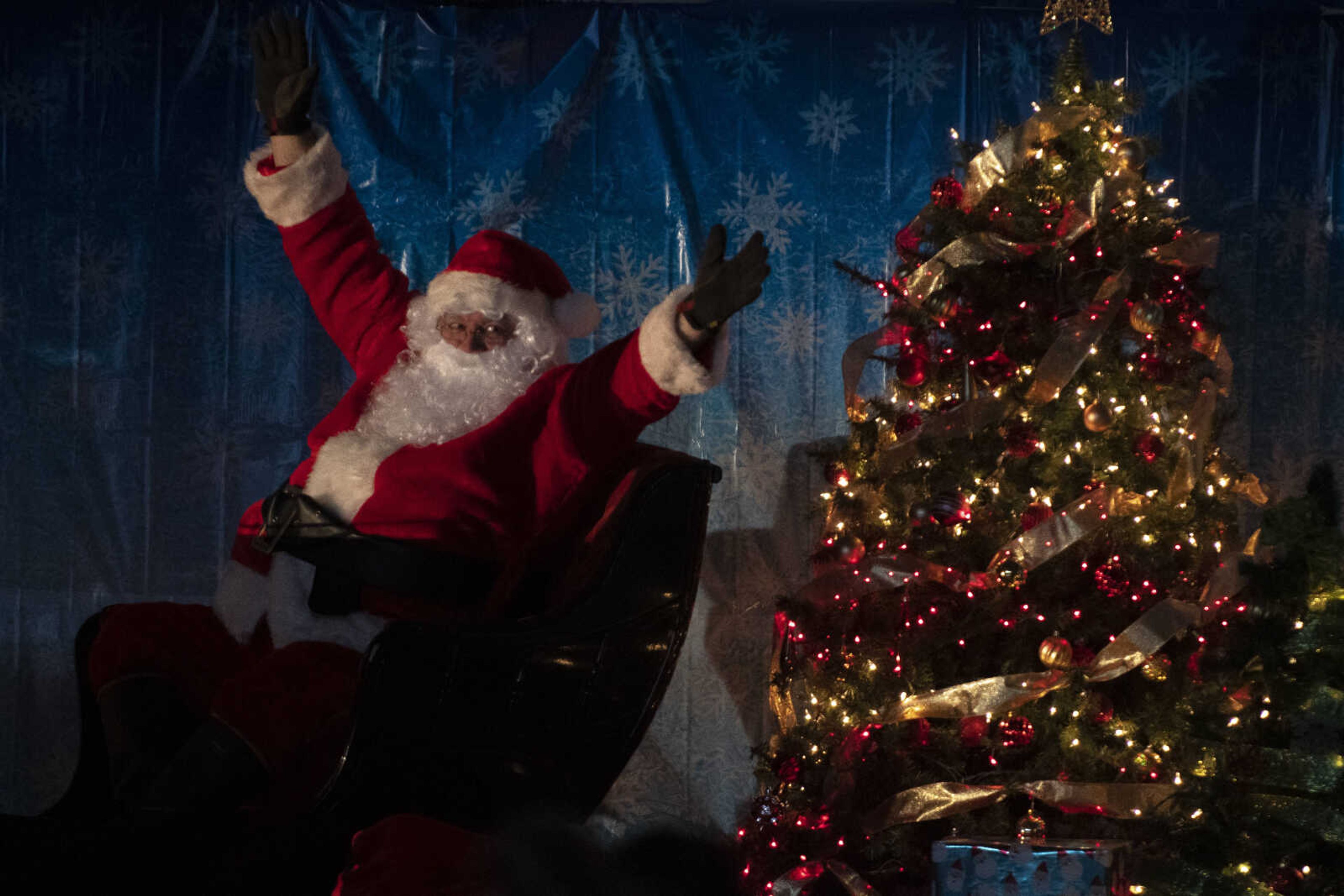 Santa Claus, portrayed by City of Cape Girardeau Parks &amp; Recreation parks division manager Brock Davis, puts up his arms during the Cape Parks &amp; Recreation Foundation's Breakfast with Santa event Saturday, Dec. 14, 2019, at the Osage Centre in Cape Girardeau.