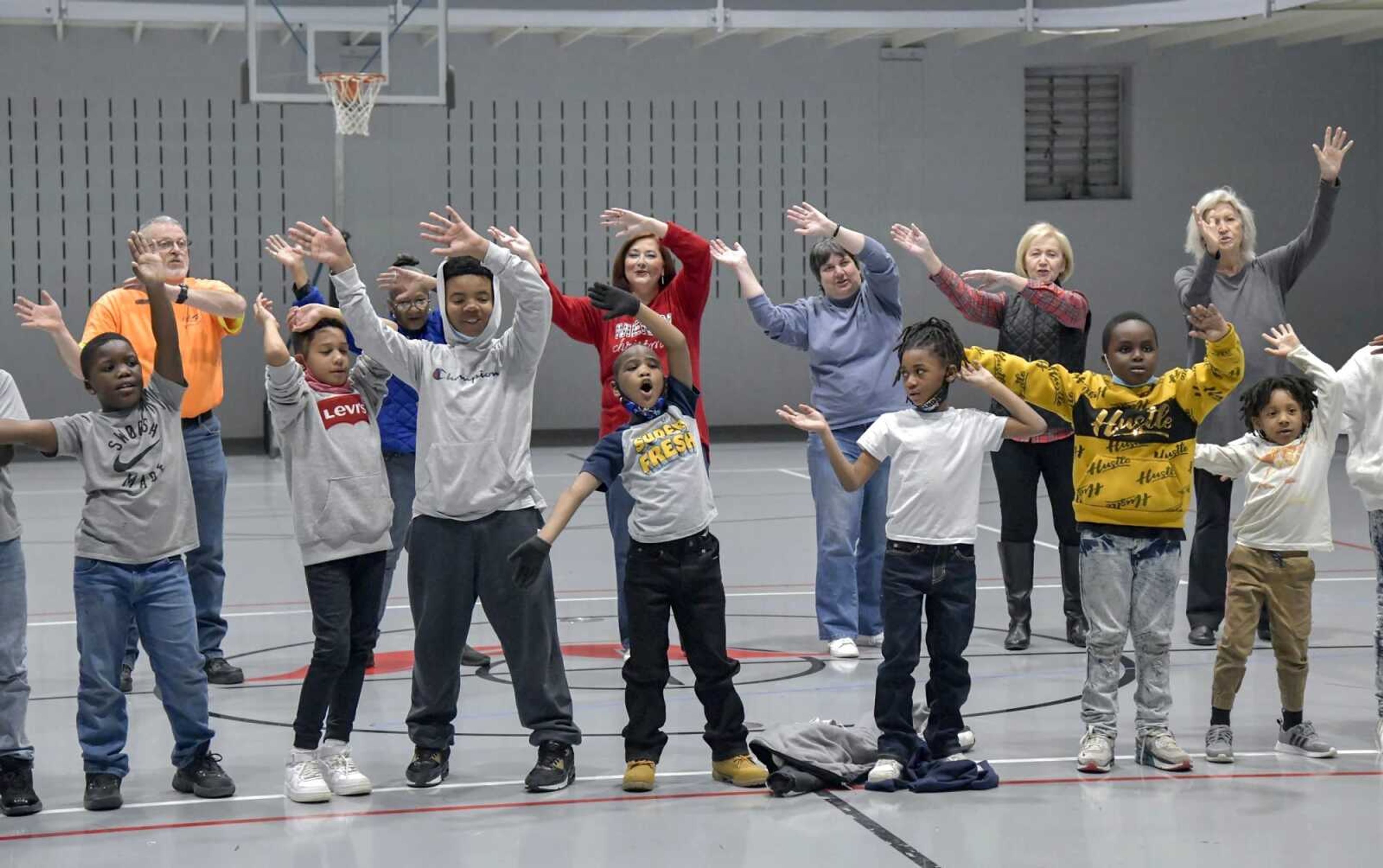 Children from the Boys and Girls Clubs of Cape Girardeau and members of the adult choir practice their performance Monday for the "Searchlight" program later this week at Centenary United Methodist Church in Cape Girardeau.