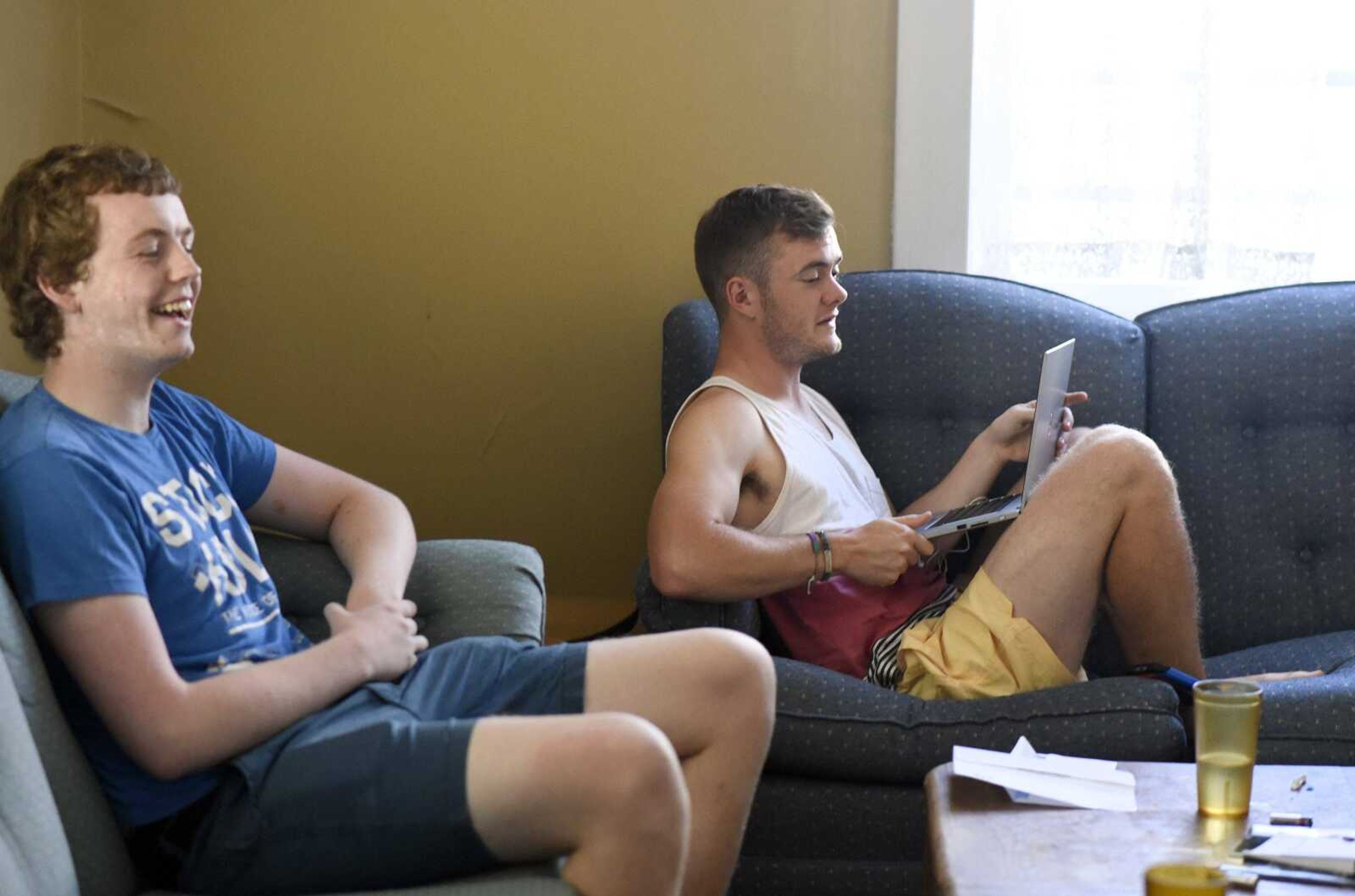 Conal O Brien, left, and Scott Sullivan, both students from Ireland, hang out inside their Cape Girardeau home on Monday, Sept. 26, 2016.