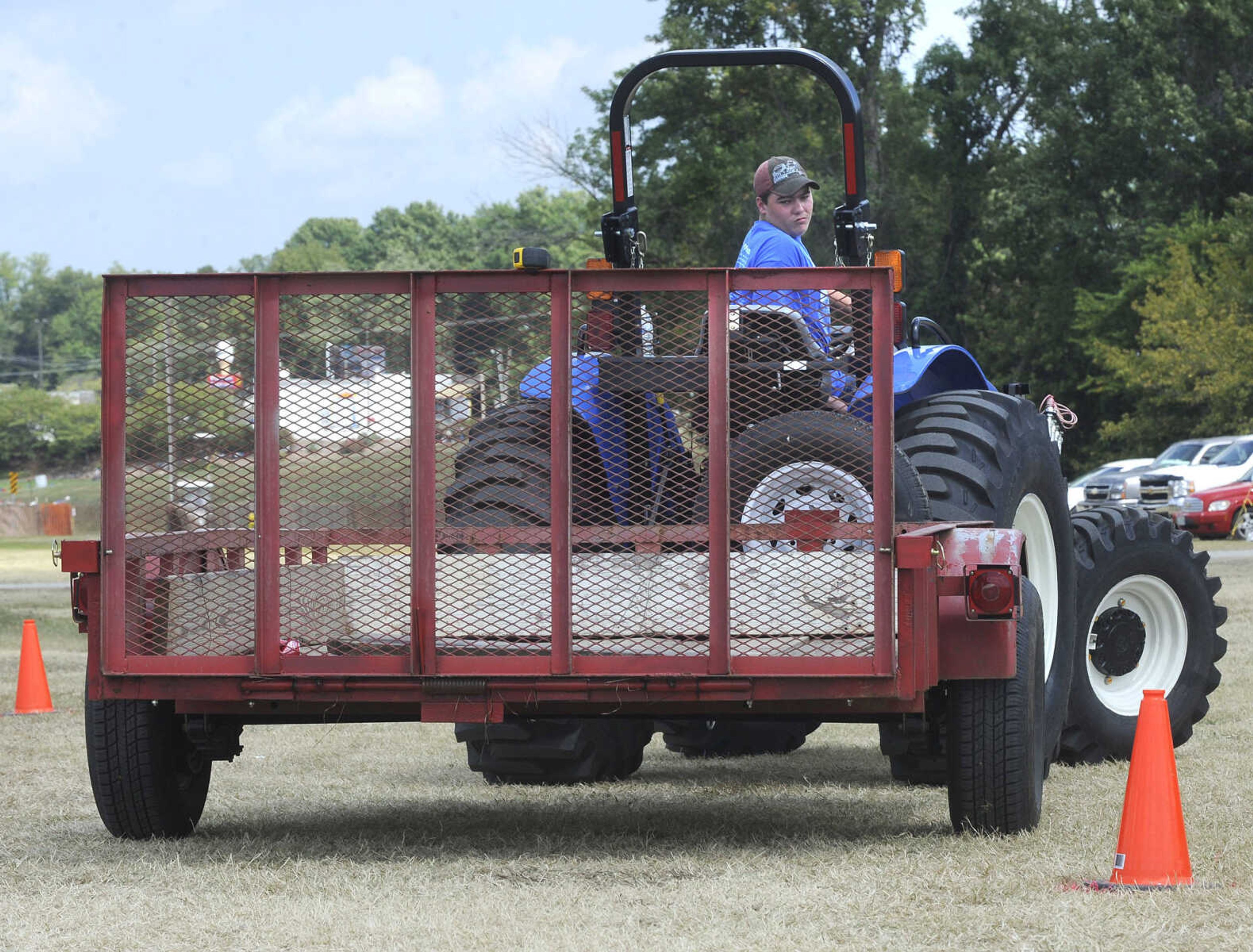 FRED LYNCH ~ flynch@semissourian.com
Matthew Haupt of Jackson drives the course in the 4-H/FFA Tractor Rodeo Friday, Sept. 15, 2017 at the SEMO District Fair in Cape Girardeau.