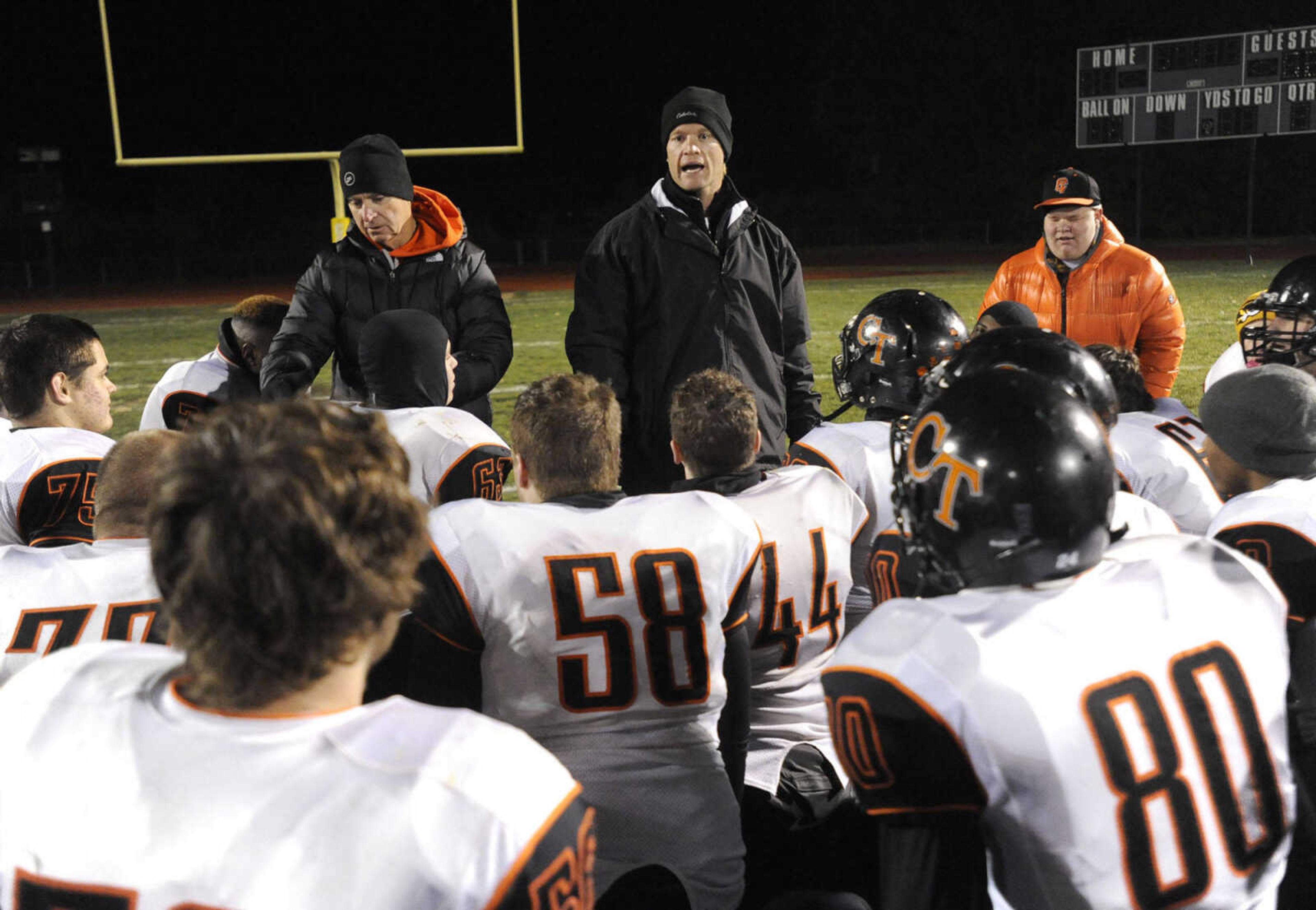 Central coach Nathan Norman talks to his team after their  34-14 victory over Affton in the Class 4 state quarterfinal Friday, Nov. 14, 2014 in Affton, Missouri. (Fred Lynch)