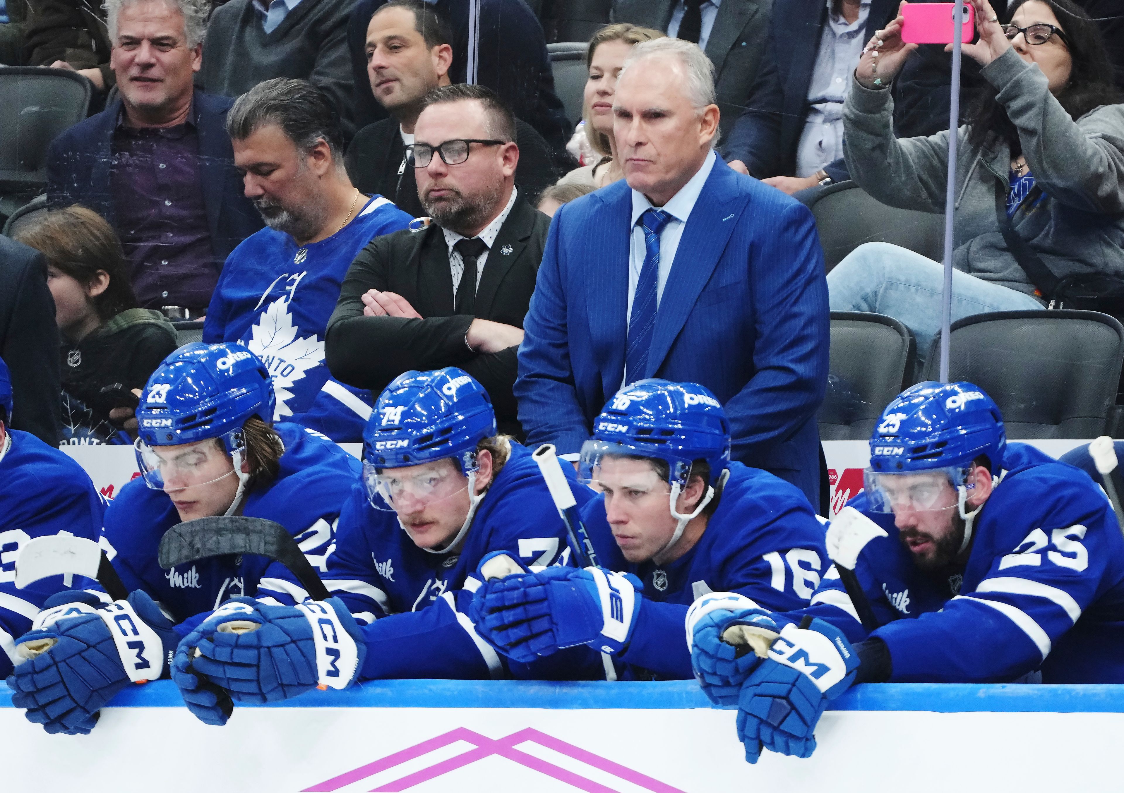 Toronto Maple Leafs head coach Craig Berube, center right top, stands on the bench during third-period NHL hockey game action against the St. Louis Blues in Toronto, Thursday, Oct. 24, 2024. (Nathan Denette/The Canadian Press via AP)