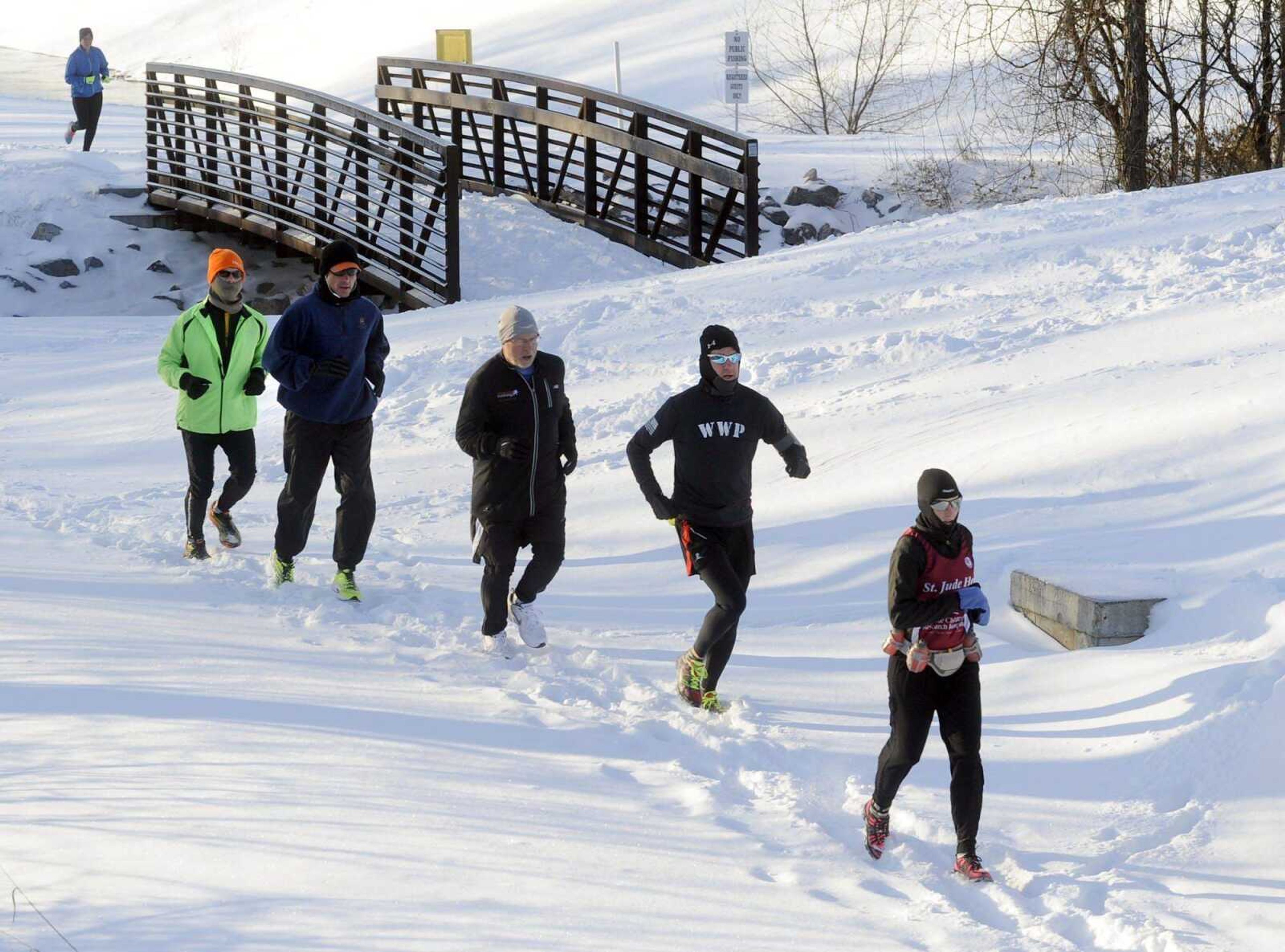 Runners proceed north toward Walden Park along the Cape LaCroix Recreation Trail during the St. Jude Frostbite Half-Marathon on Saturday in Cape Girardeau. (Fred Lynch)